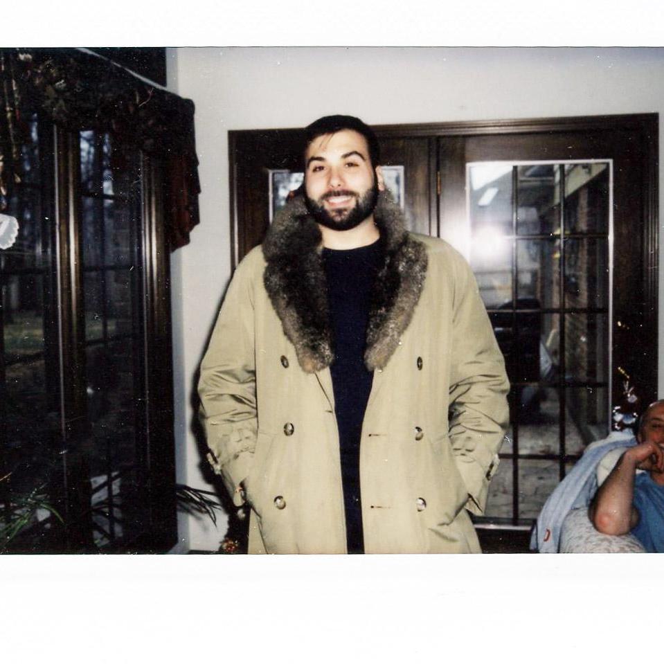 Alessandro gets a style lesson from Grandpa Shanks, donning a raccoon skin coat on Christmas Day 2016