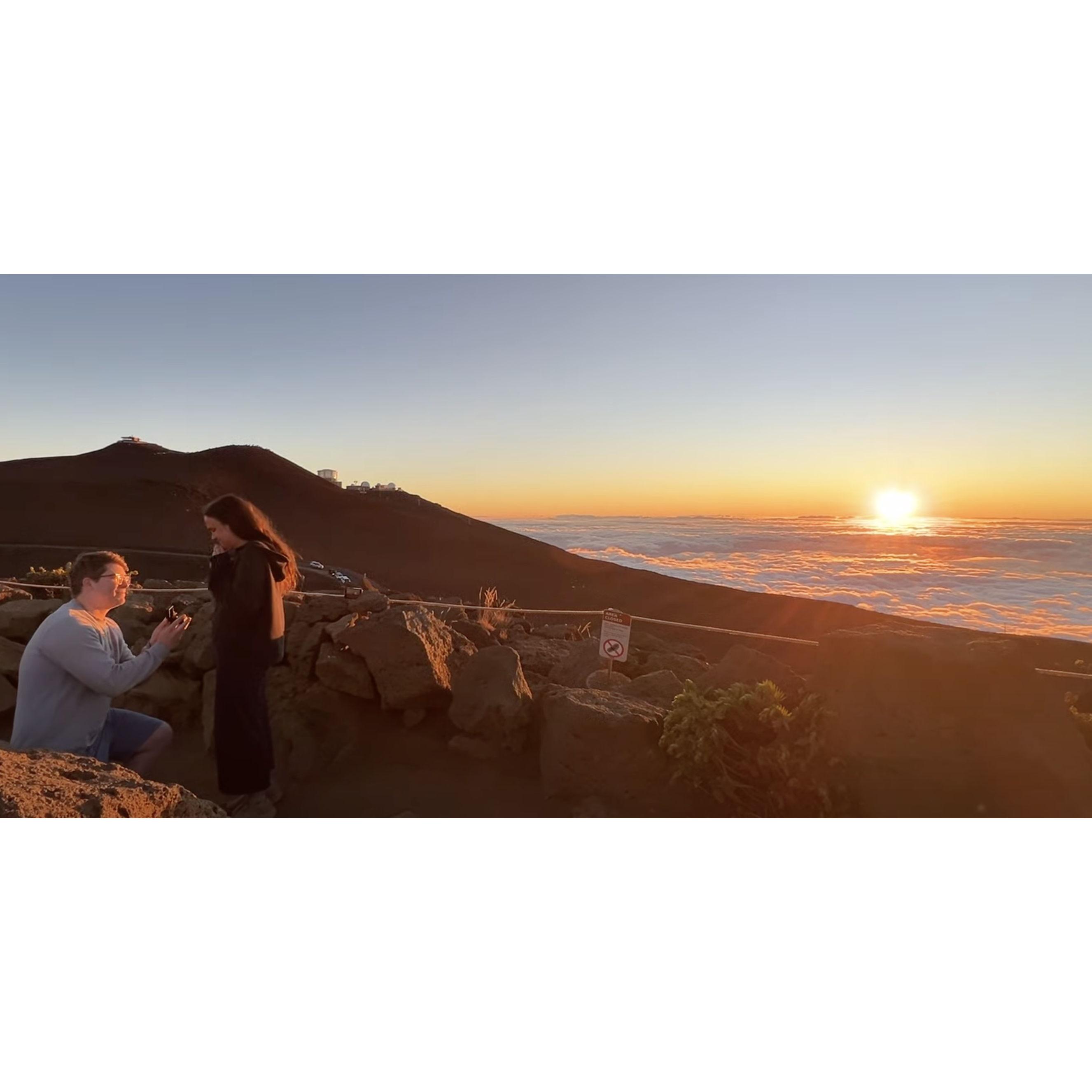 Sam proposing at sunset at the top of Haleakala in Maui