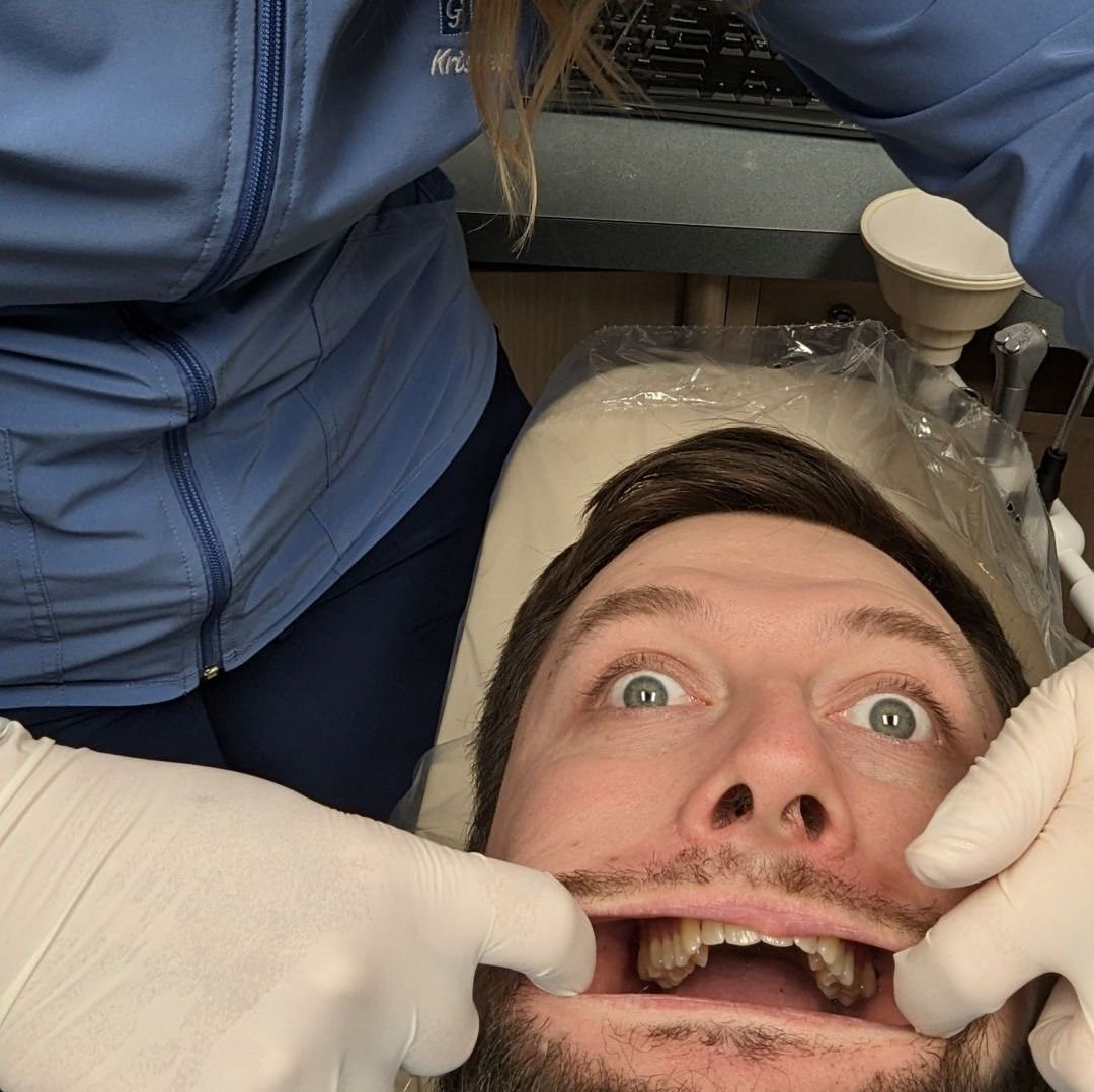 This was Kristen's first time cleaning Eric's teeth!