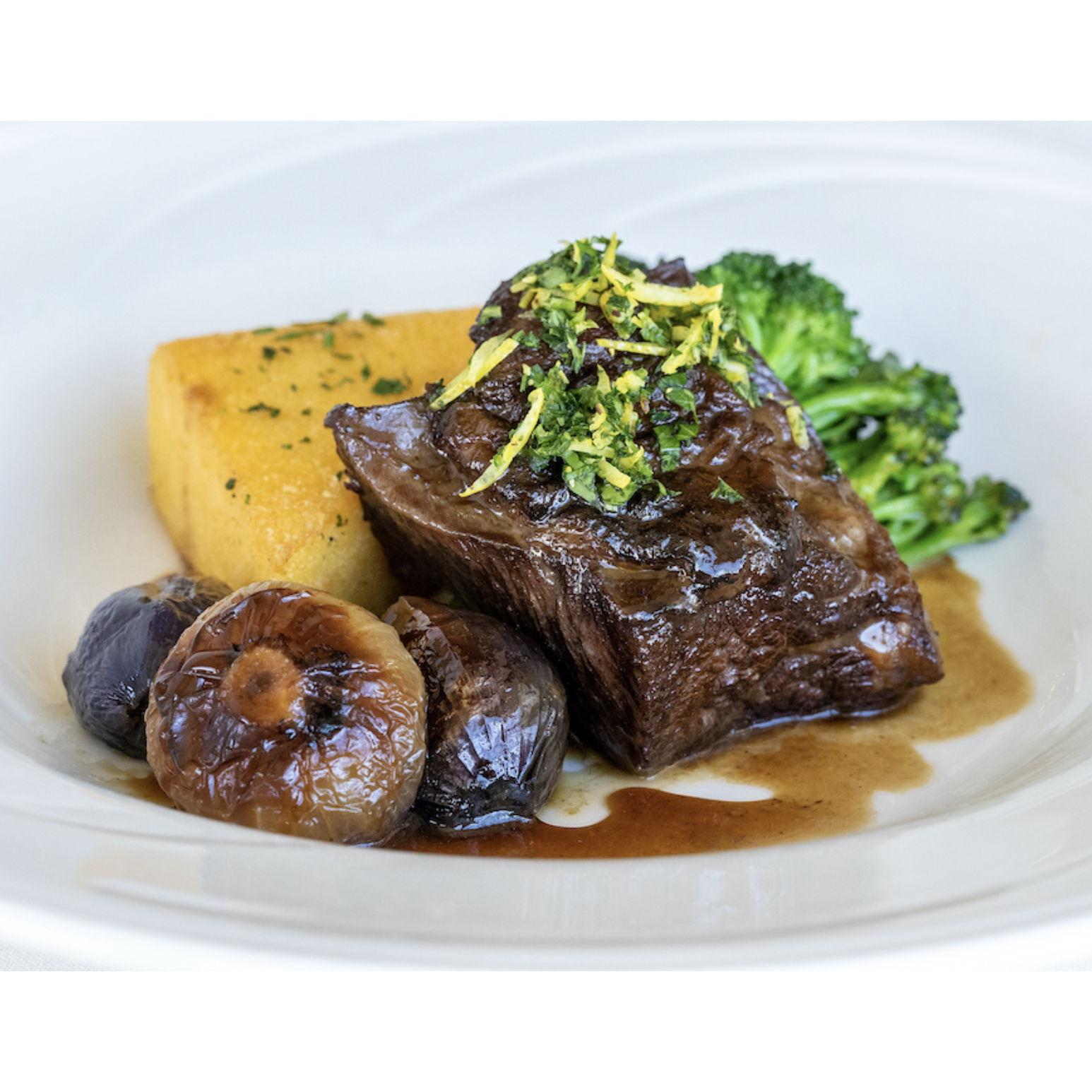 Beef Short Ribs: Slowly Braised in Pinot Noir and Lager, Served with Cipollini Onions, Seasonal Vegetable, Fried Polenta and Au Jus. Dusted with Fried Shallots and Gremolata.