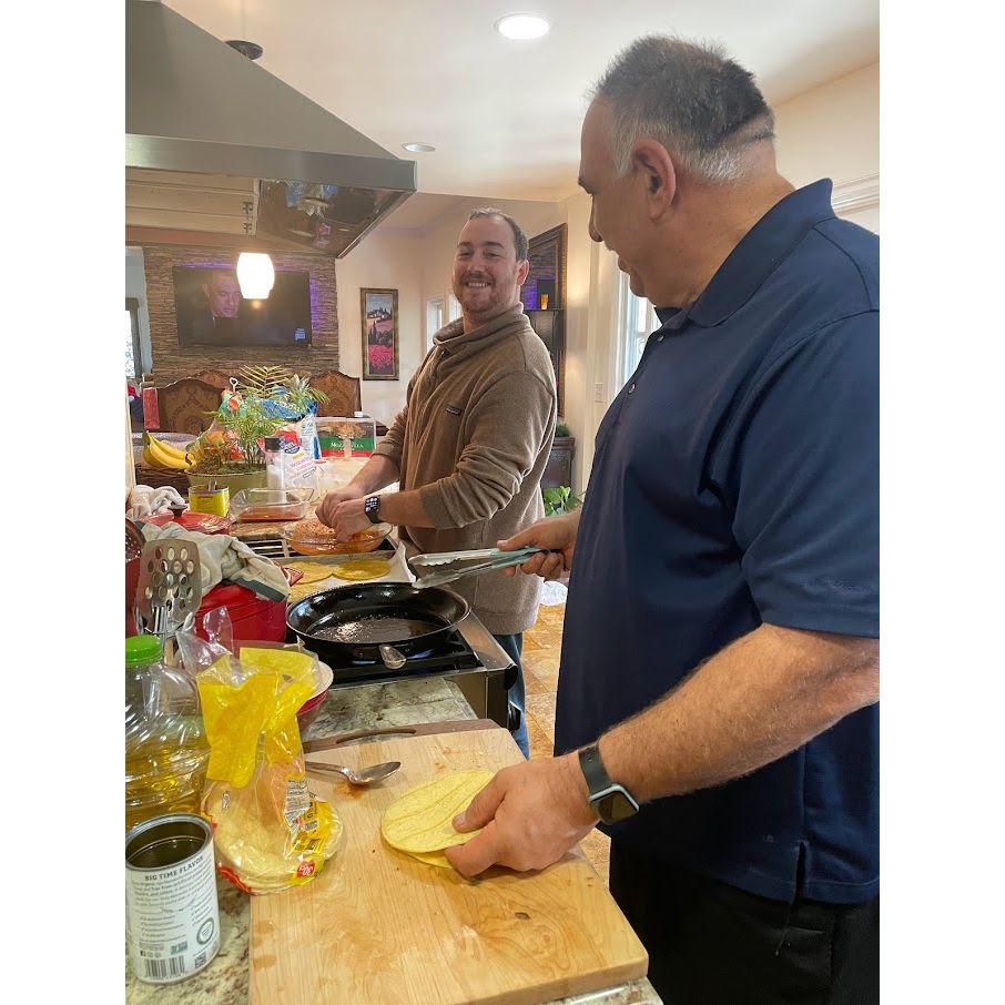 Our first Christmas together wouldn't be complete without Drake making enchiladas with Tony, Brandi's dad.