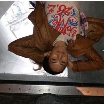 Top of the CN Tower. Scott was freaked out I laid on the glass. You can see the street below