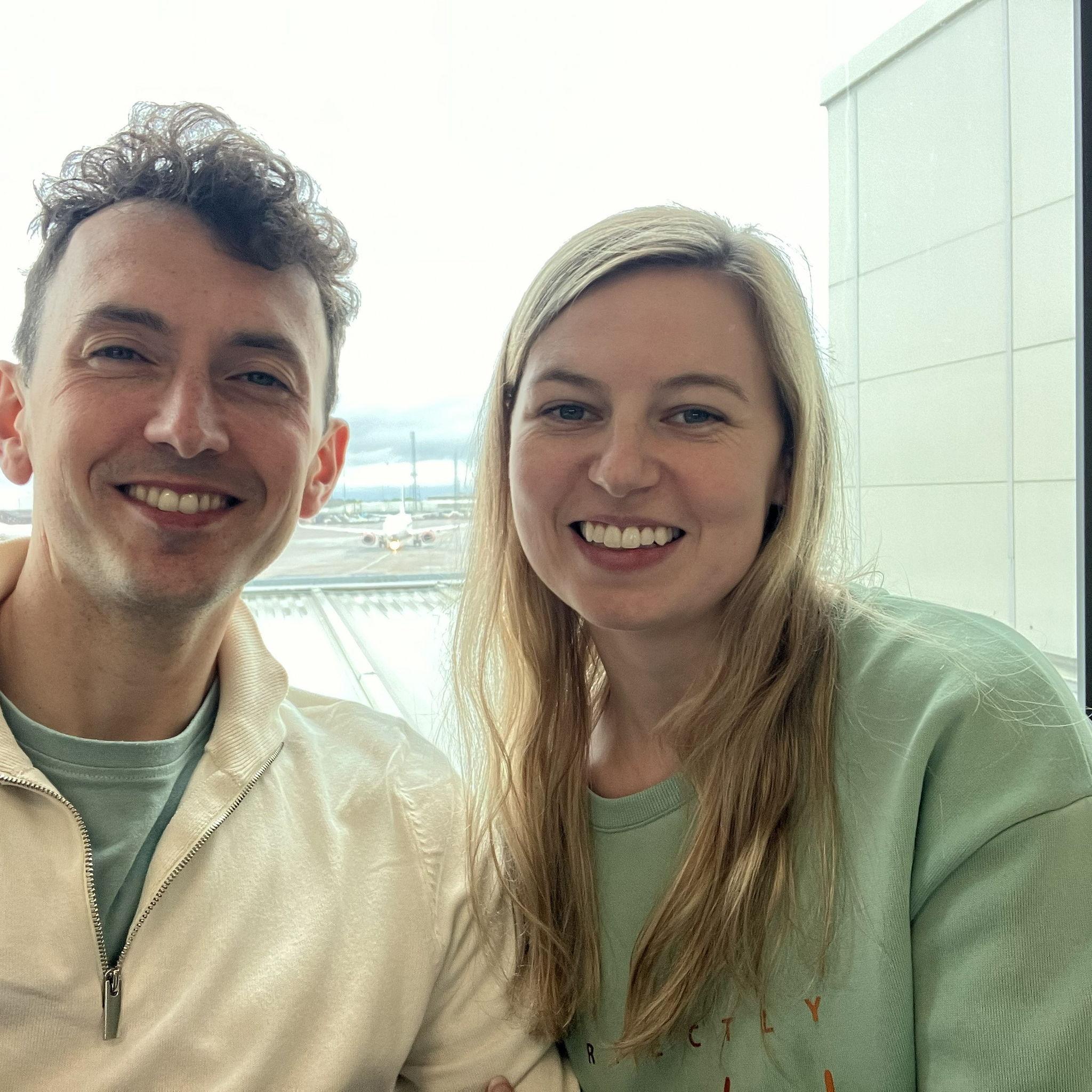 In the airport ready to fly away for David's surprise Birthday holiday.