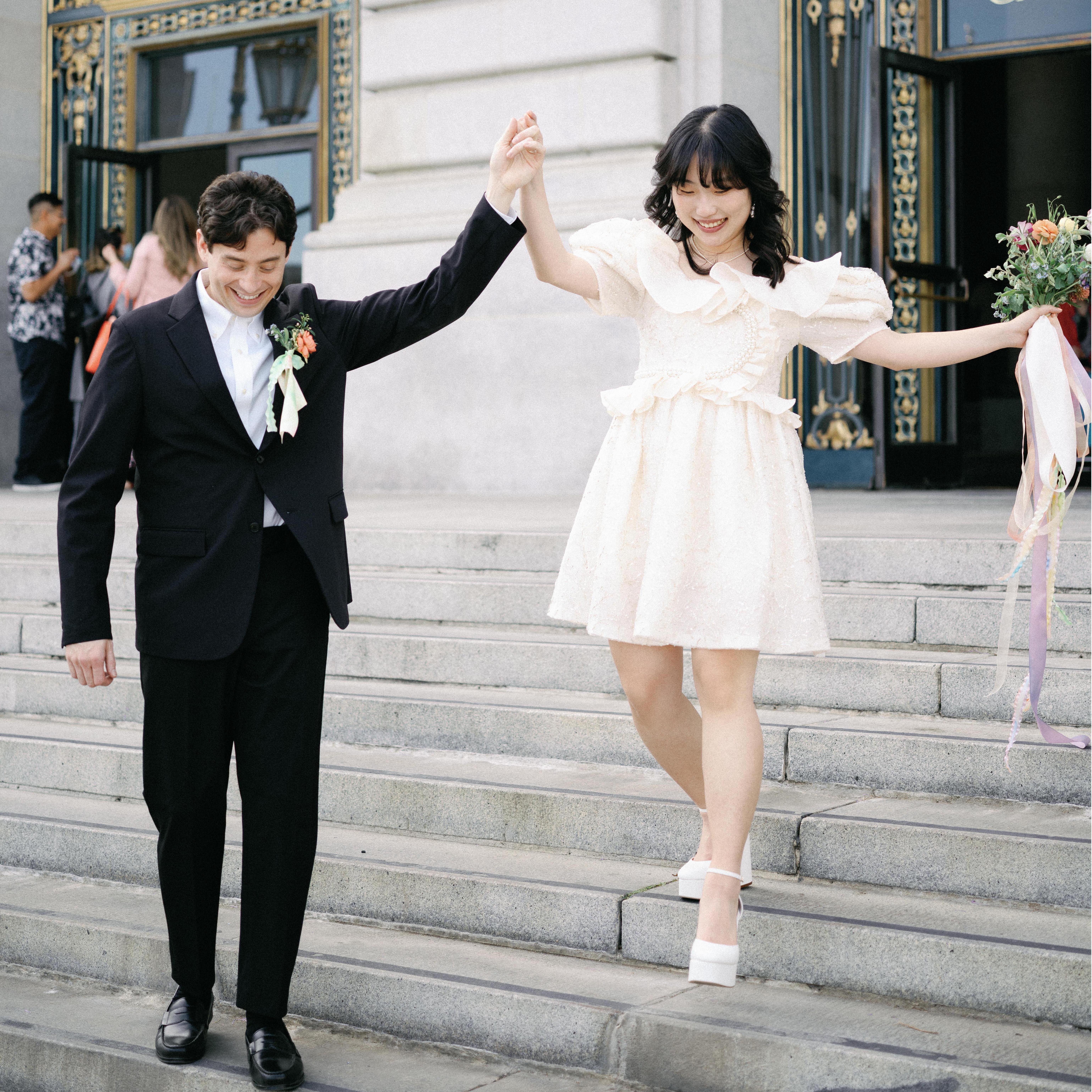 After wedding ceremony, holding hands together