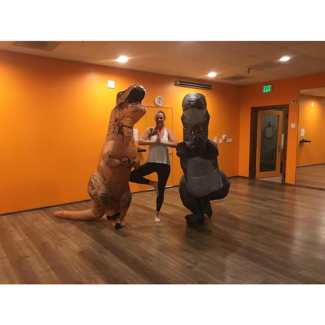 Kelly and Kalia at their local yoga studio posing with one of the teachers on Halloween