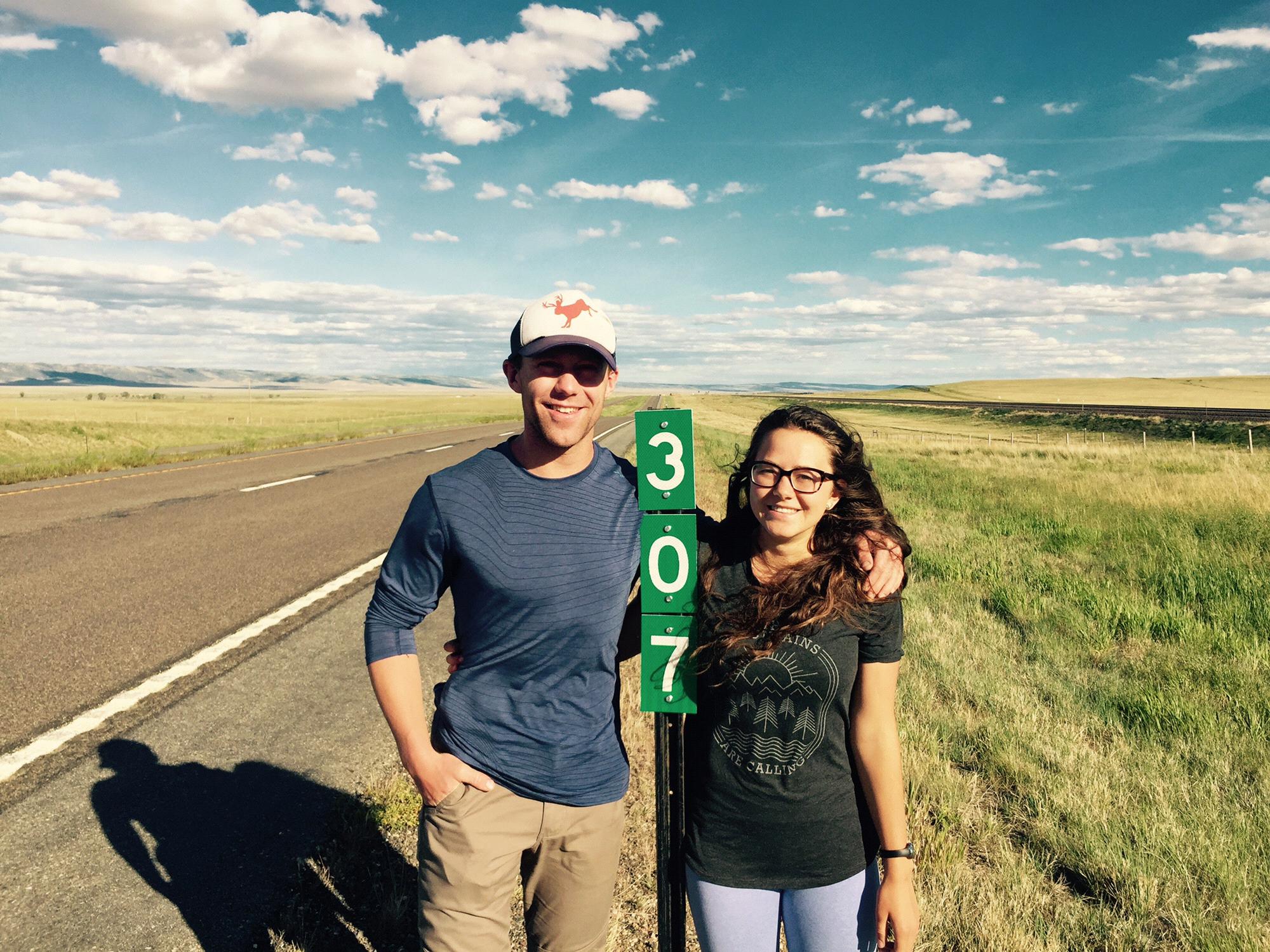 You know you're from Wyoming when you pose with a mile marker.