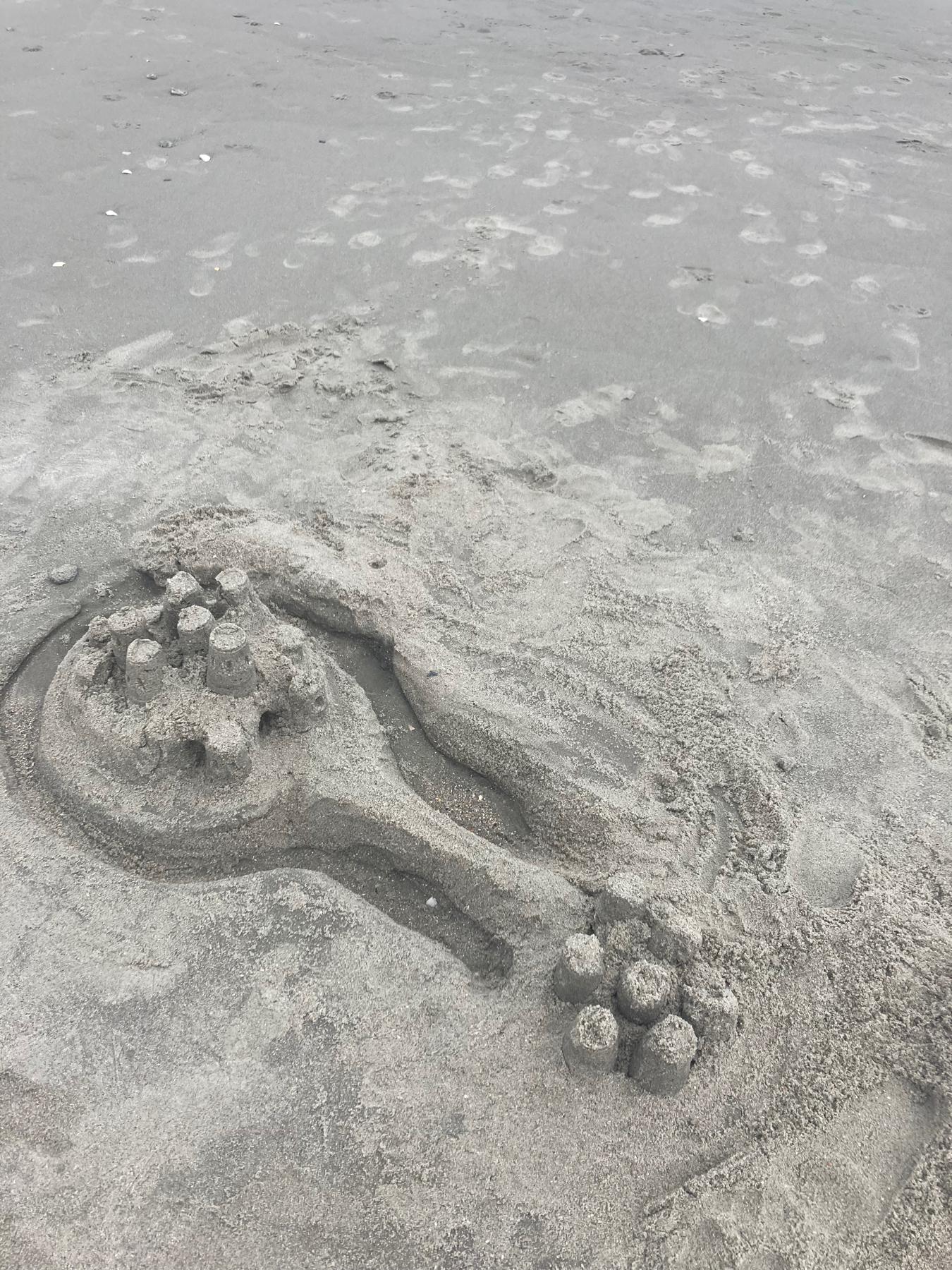 Kendrick never built a sand castle and always wanted to make one, so we did for the first time together.