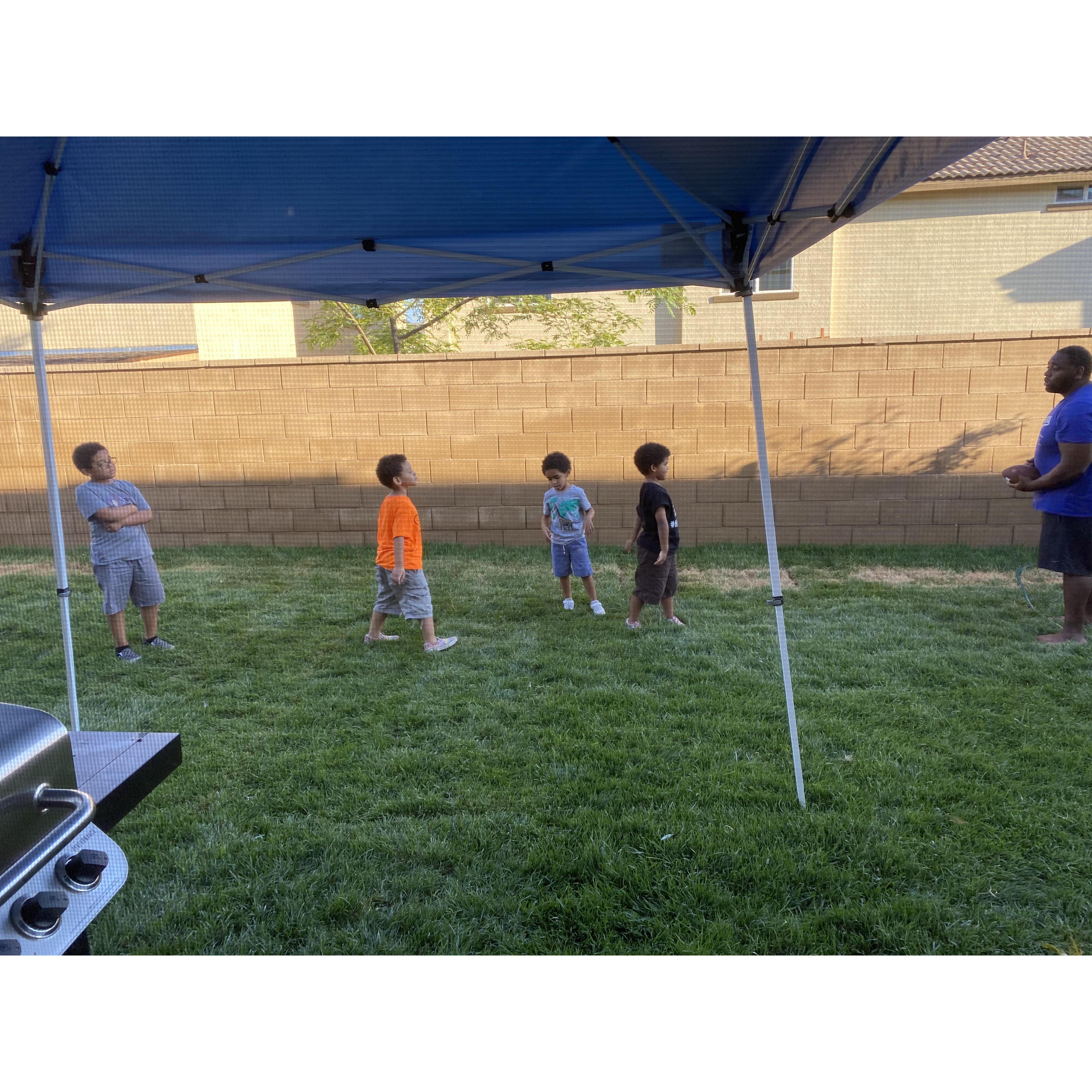 Teaching the boys to play football.