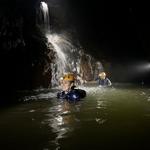 Caving swimming, repelling, and free jumping