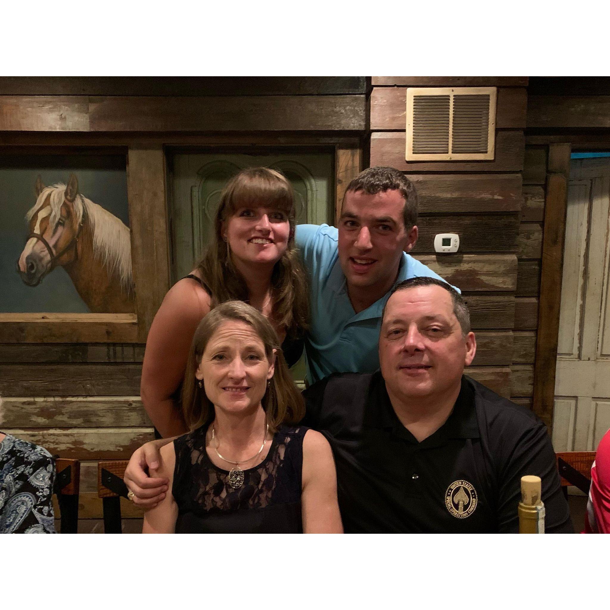 Austin and Kelly at Kelly's college graduation party with Austin's proud Dad and Stepmother Chris and Cathy Burns they are so excited to have Kelly as their daughter in law.