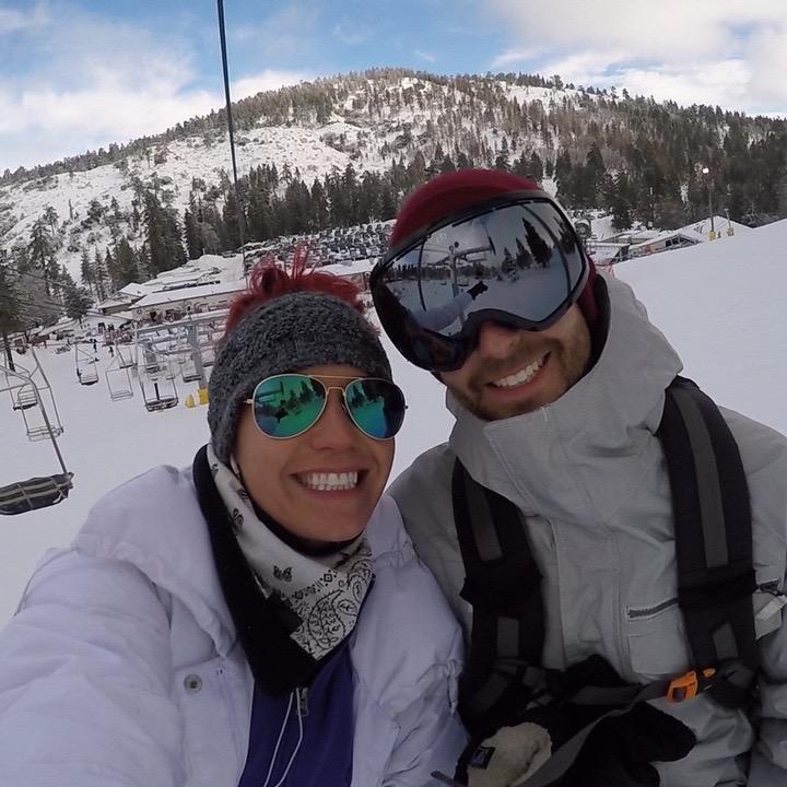 Dannielle pretending like she knows how to snowboard while Christian completely shreds.