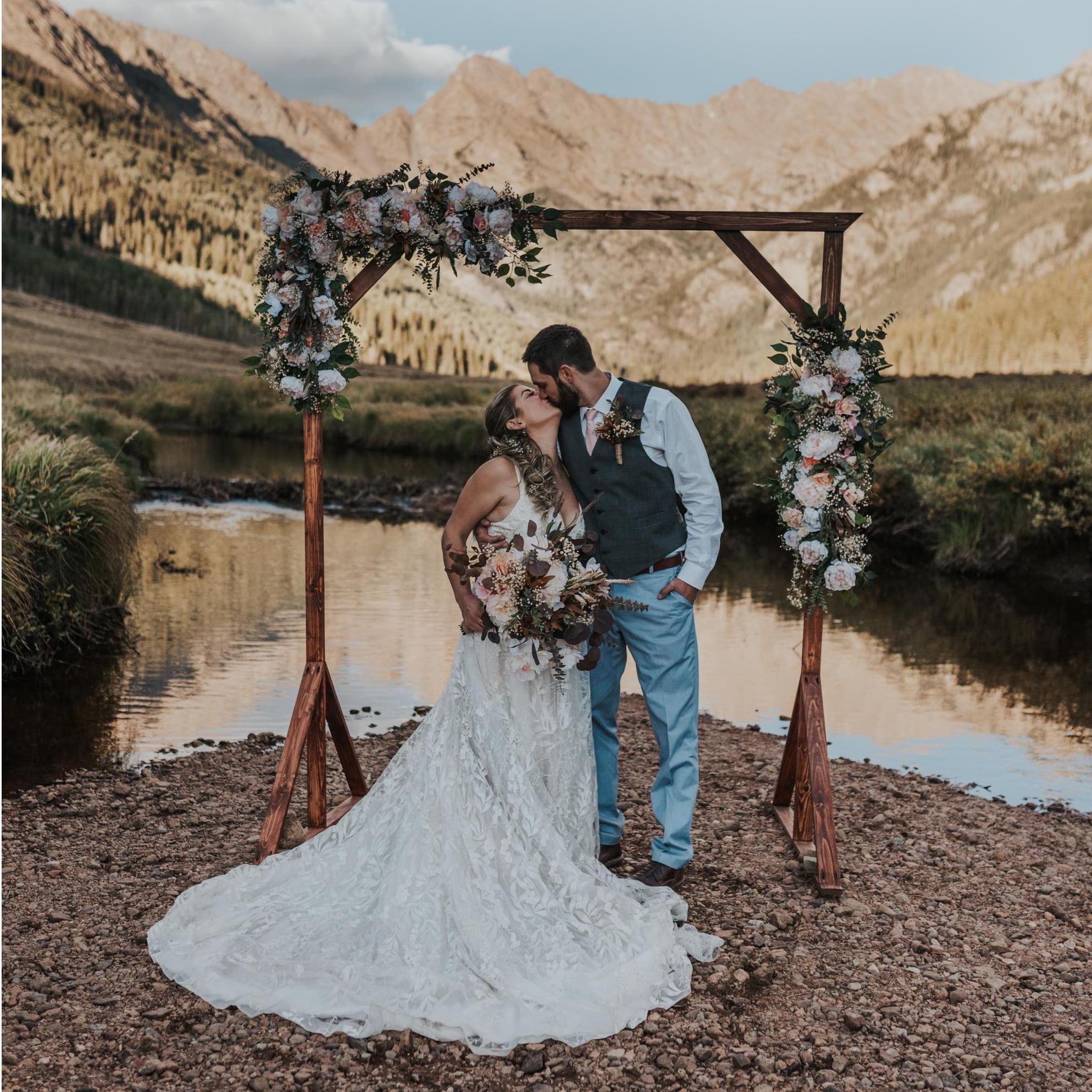 Justin made the arch and I made the florals and my dress:)