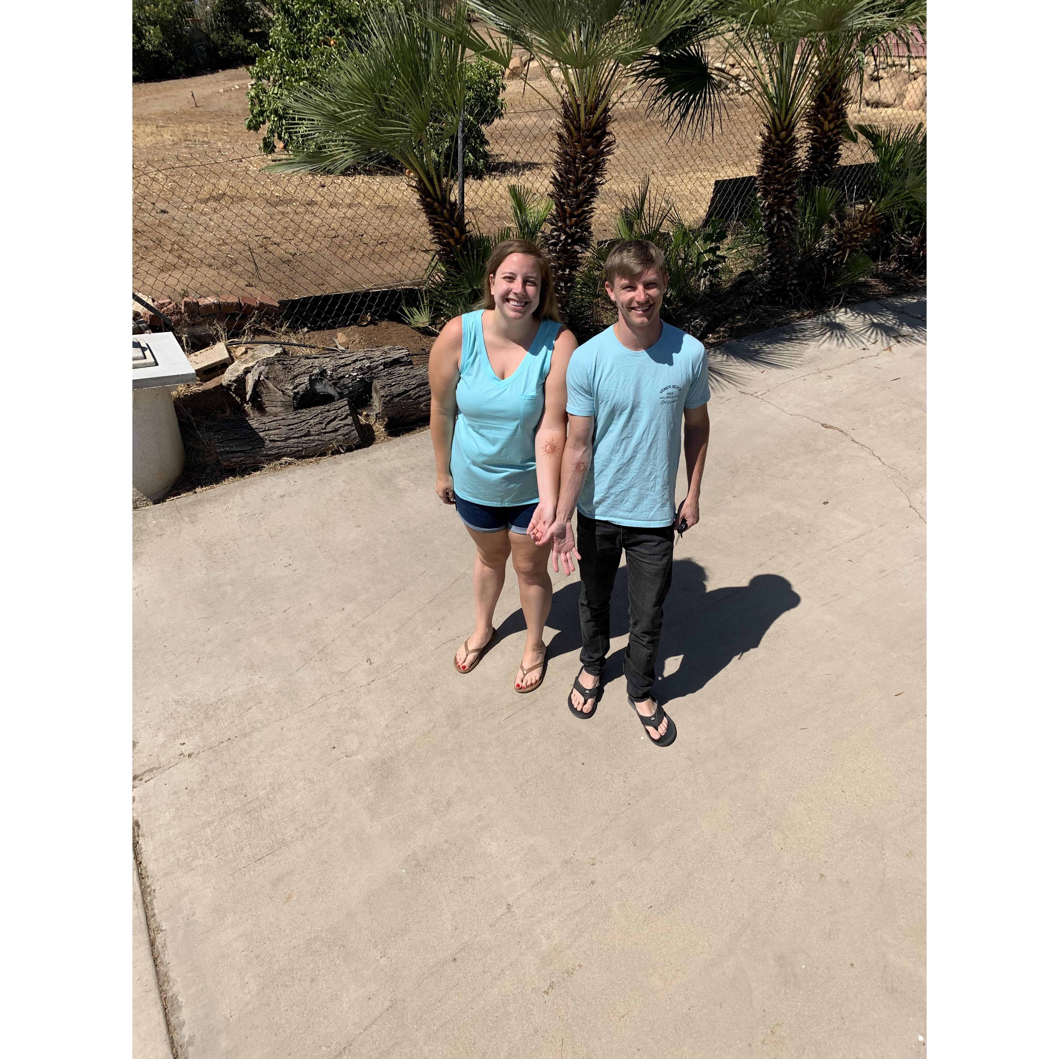 A photo after one of their first dates, to the San Diego Fair, where they got matching Henna and accidentally matched shirts!
