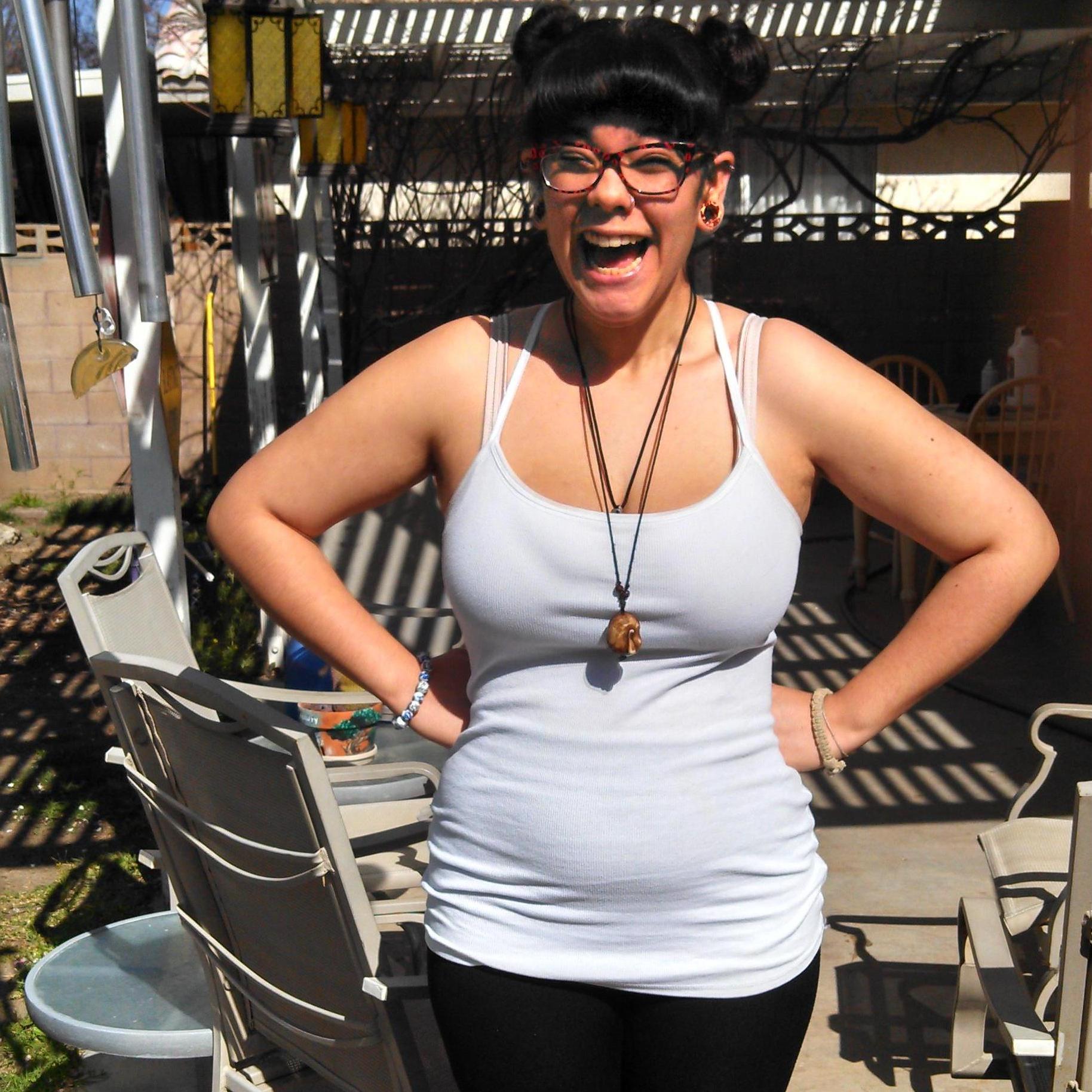 Tyler trying to get me to be serious enough to take a "baby bump" picture, while pregnant with Orion, 2014.