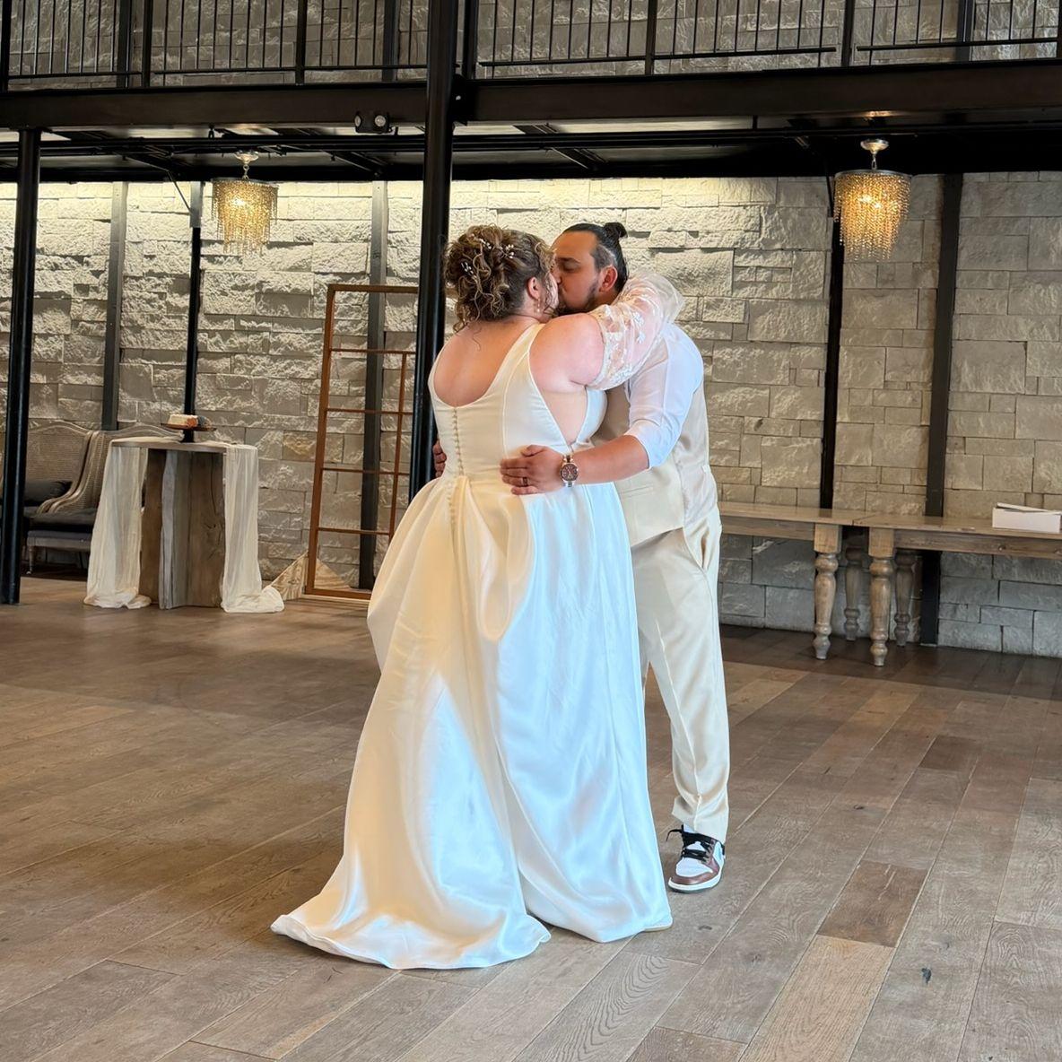 The Bride and Groom share a kiss during their first dance