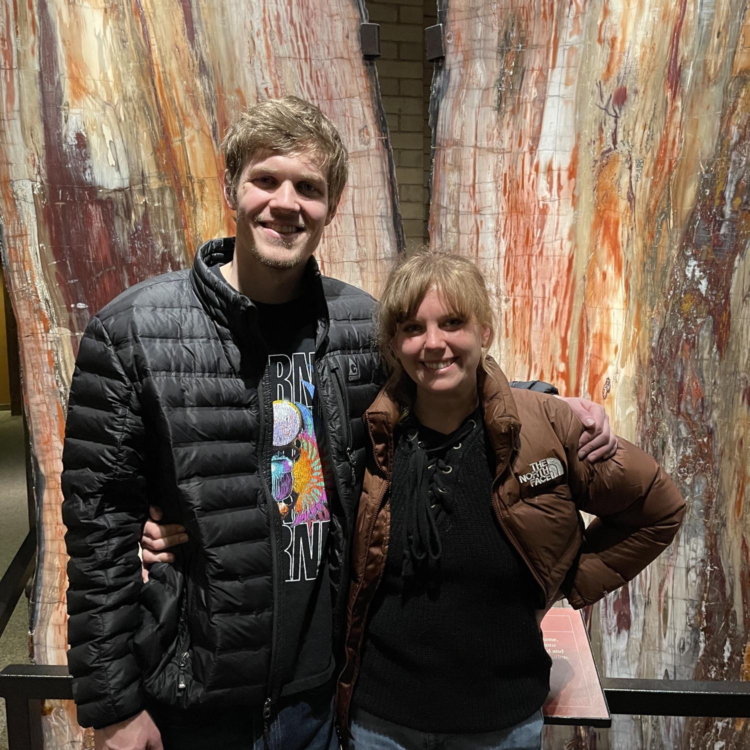 With the petrified tree at the Denver museum of nature and science - one of our favorite date places!