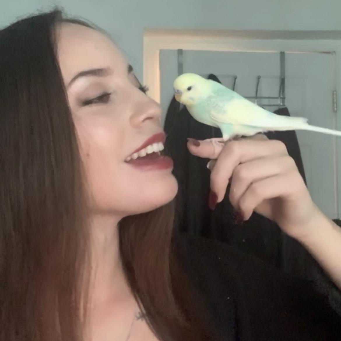 Izabella with her baby bird that she got when she was 15 years old