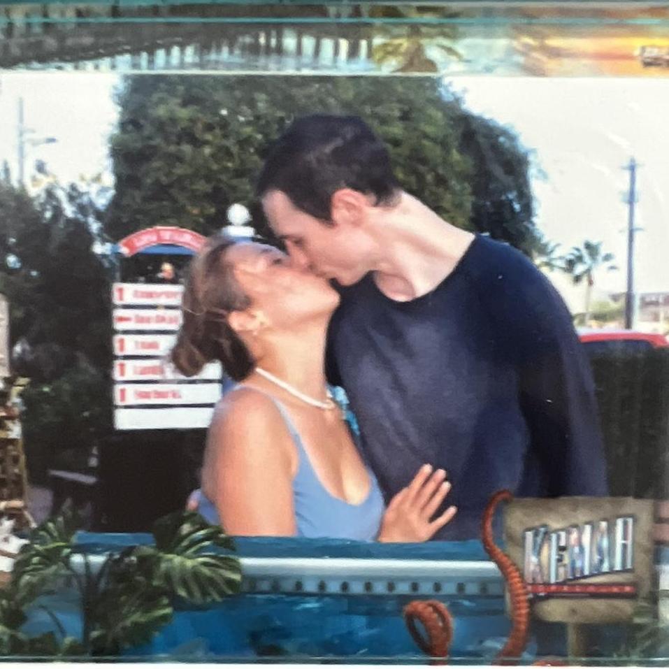 The first ever photo of the couple sharing a kiss
