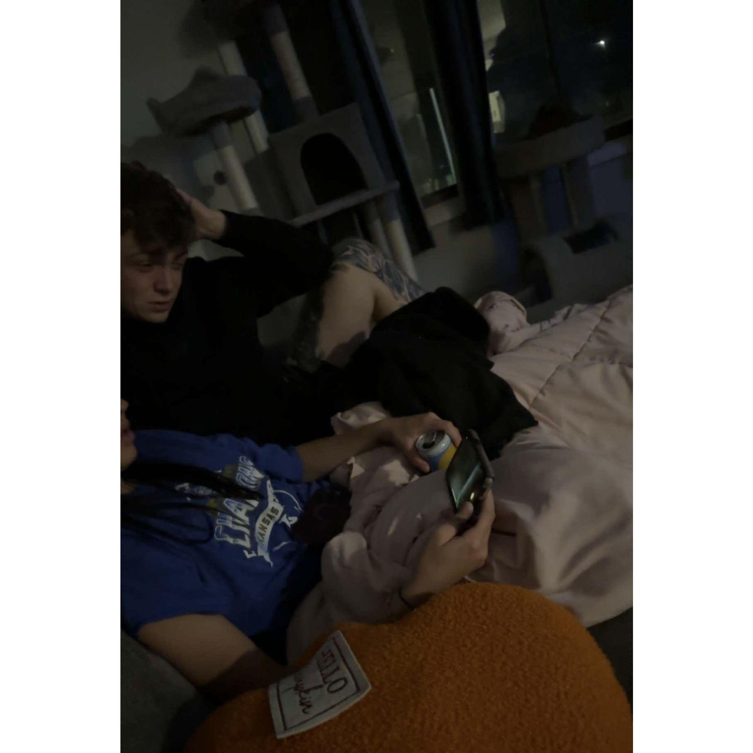 The first time we met in person, my sneaky sister caught this photo of us watching through Ben's phone as he played some VR game.