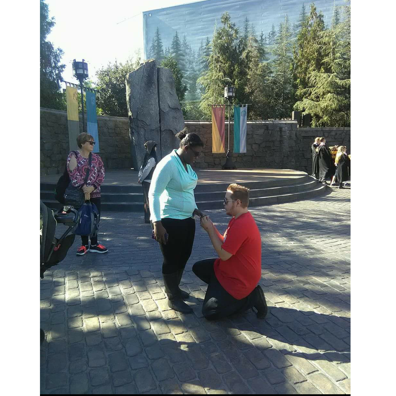 Universal Studios Hollywood- wizarding world of Harry Potter.... Re- proposed in front of my favorite place ever 😂🤵👰