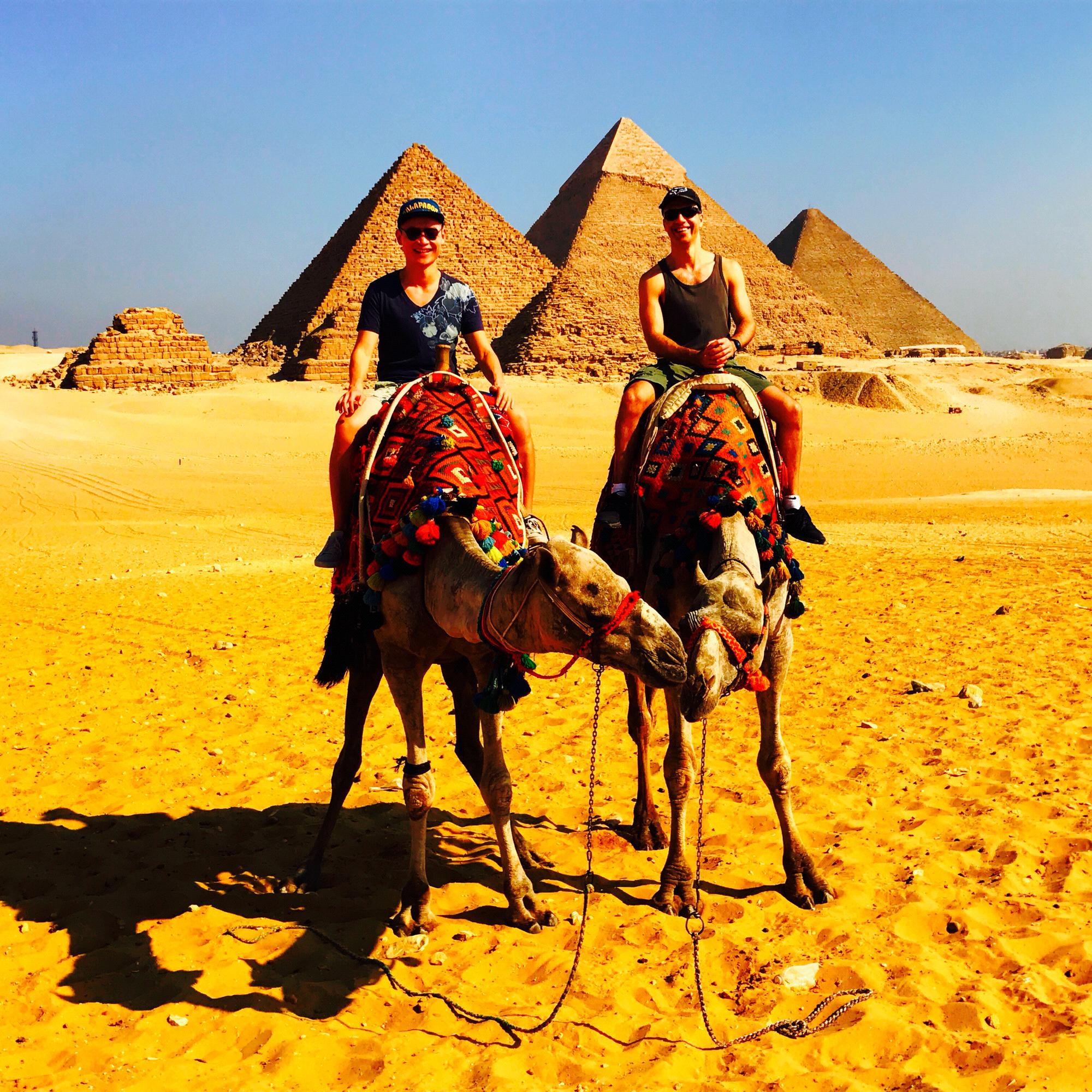 Our first time riding camels who are apparently kissing each other. In front of the pyramids of course. Egypt. October 2017.
