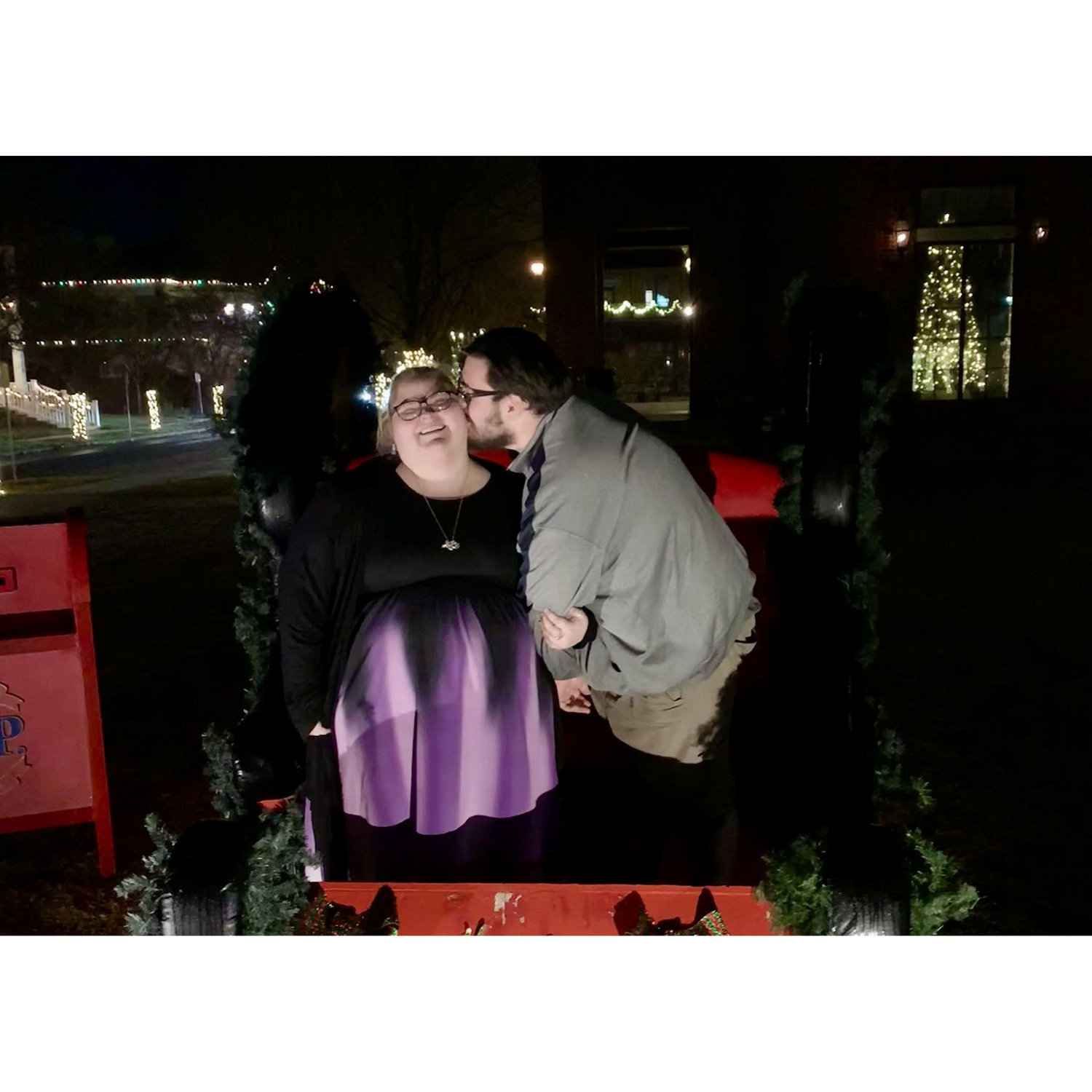 Christmas starts early these days, so the couple took a few pictures in this Christmas sleigh to commemorate the start of their first Christmas season while dating.