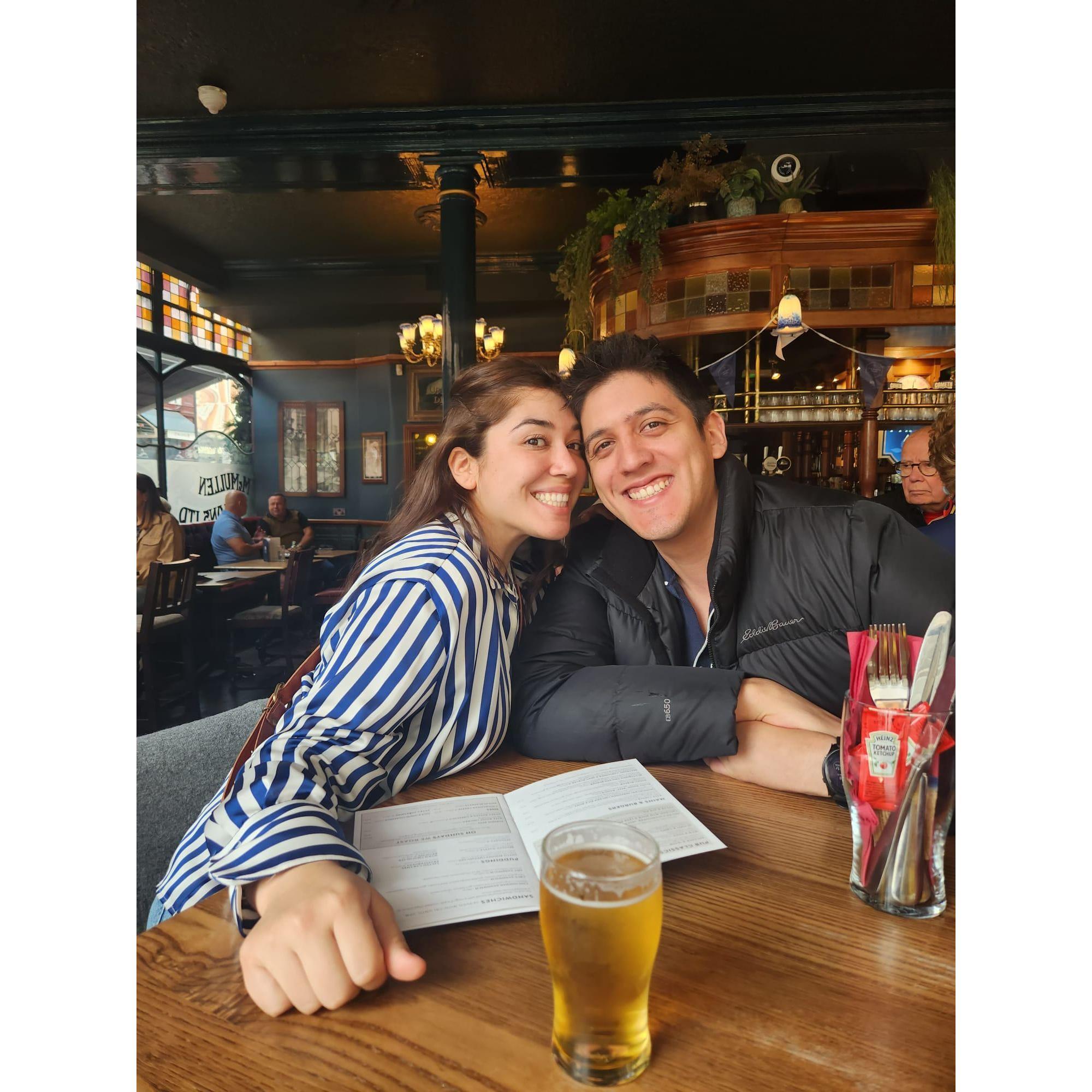 Enjoying the pubs in London.