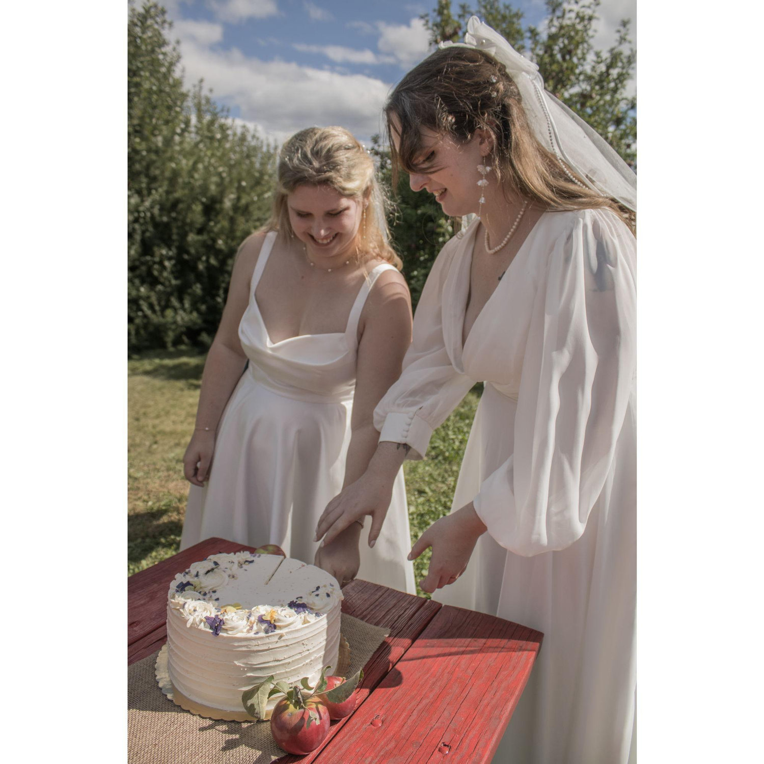 Lillian and Tabitha cutting their cake.