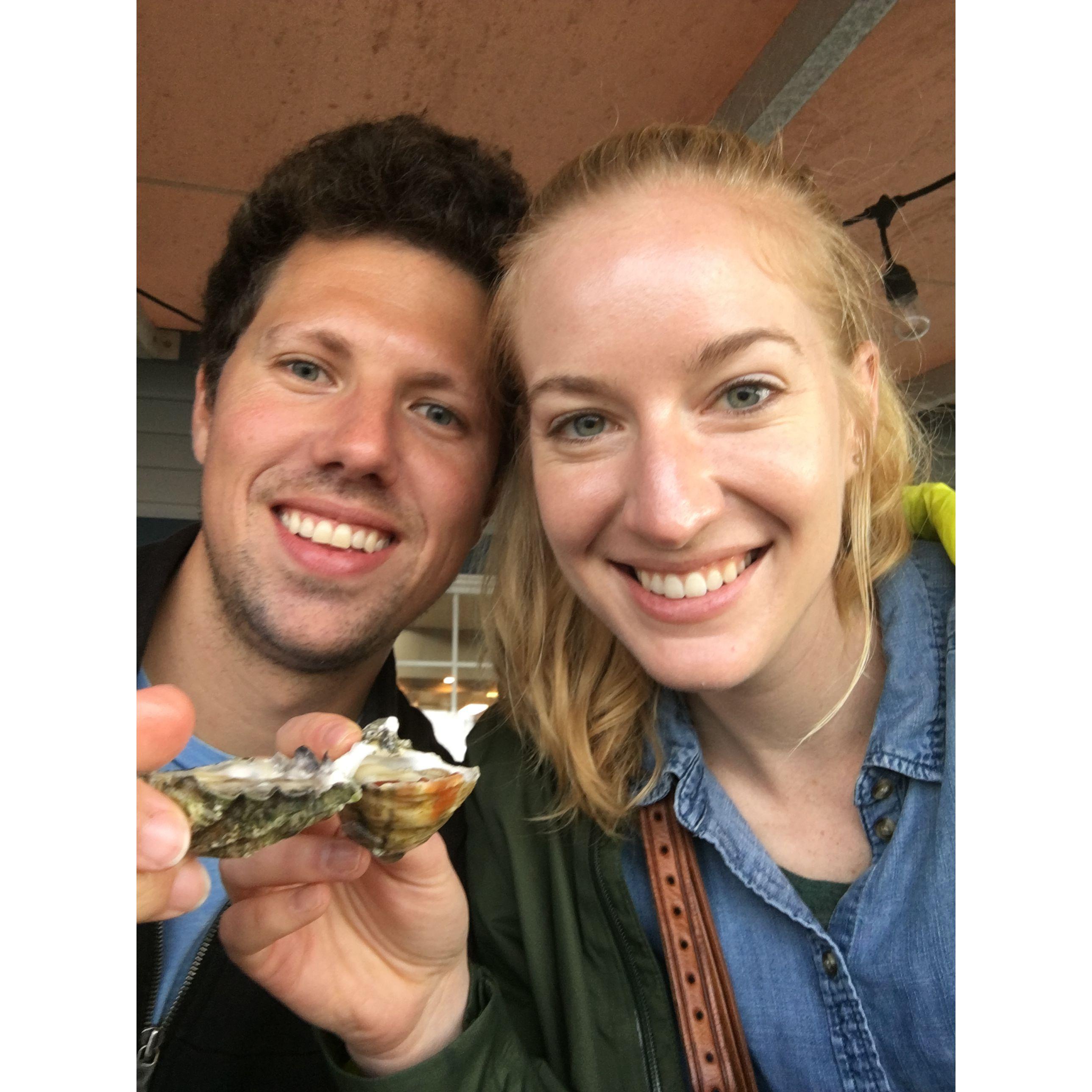 Enjoying oysters with friends in Seattle, Washington in 2019.