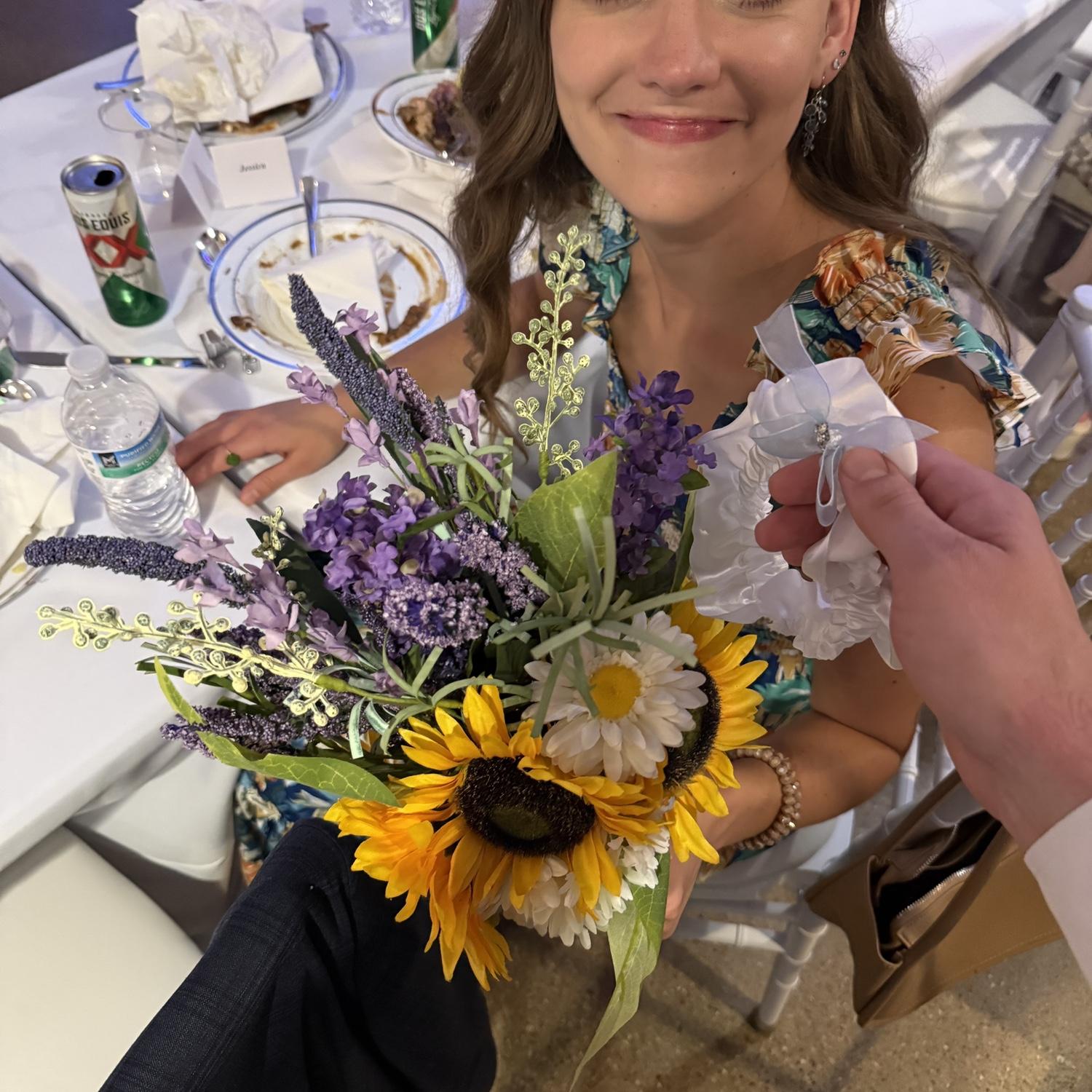 At the Norman's wedding, I caught the bouquet. Max was given the garter by the little kid who caught it. A week before the proposal happened!