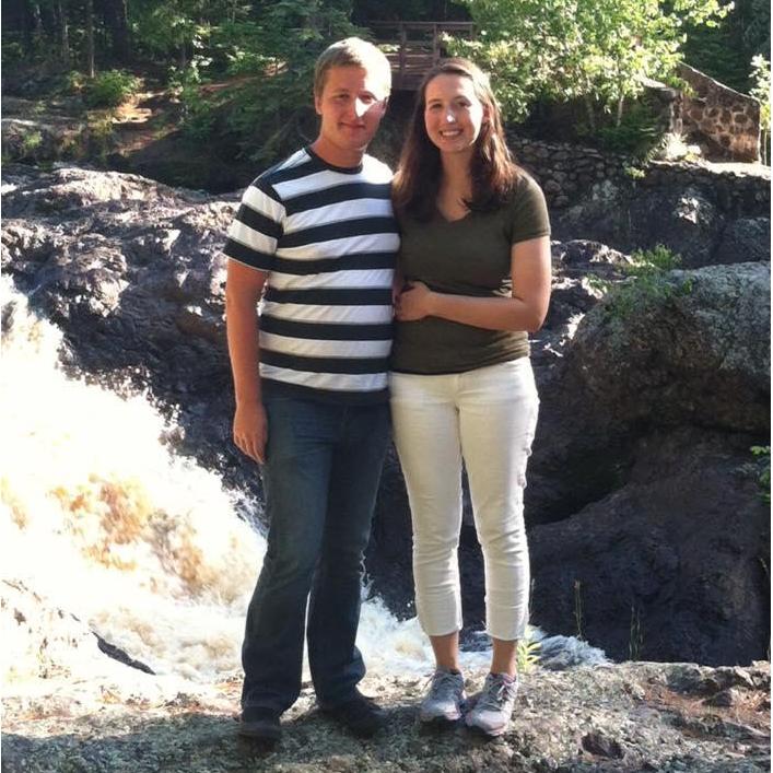 Next to a waterfall at Amnicon Falls State Park in Wisconsin, on a trip with Steffany's family, in 2014.