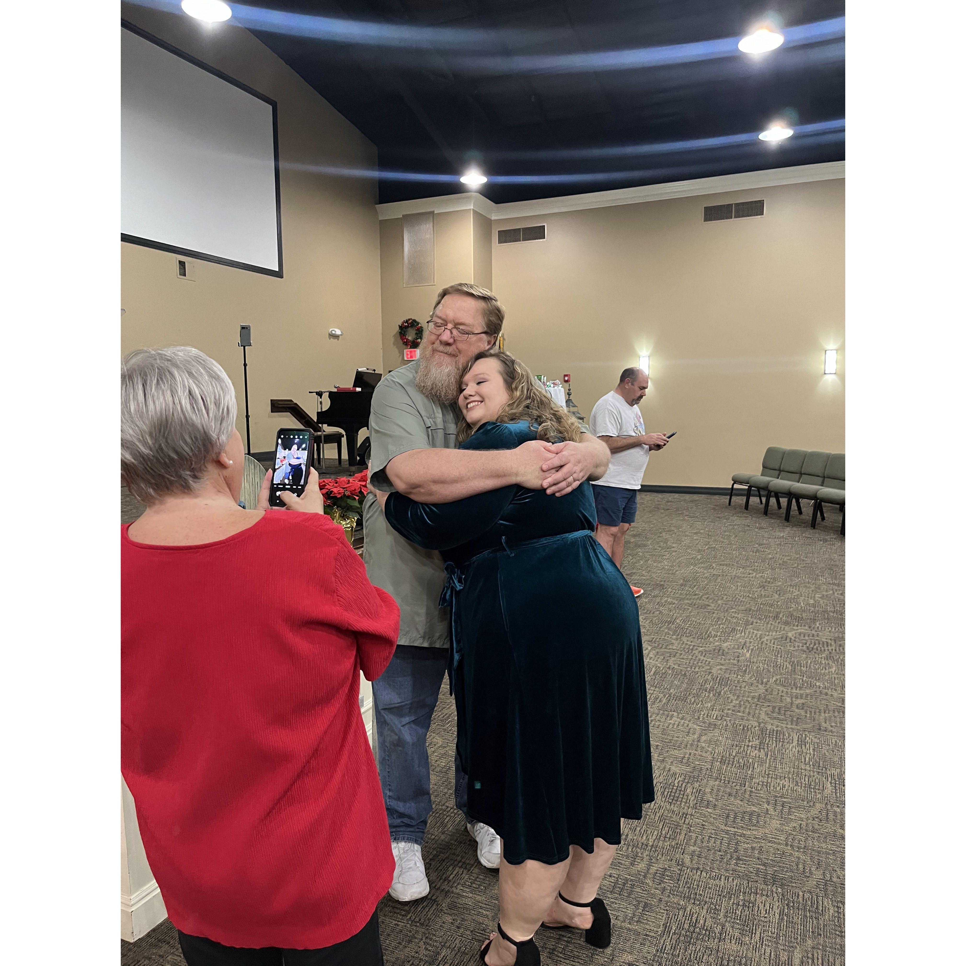 The night we got engaged, my mom is in the red and my dad is the one I'm hugging! Definitely a daddy's girl