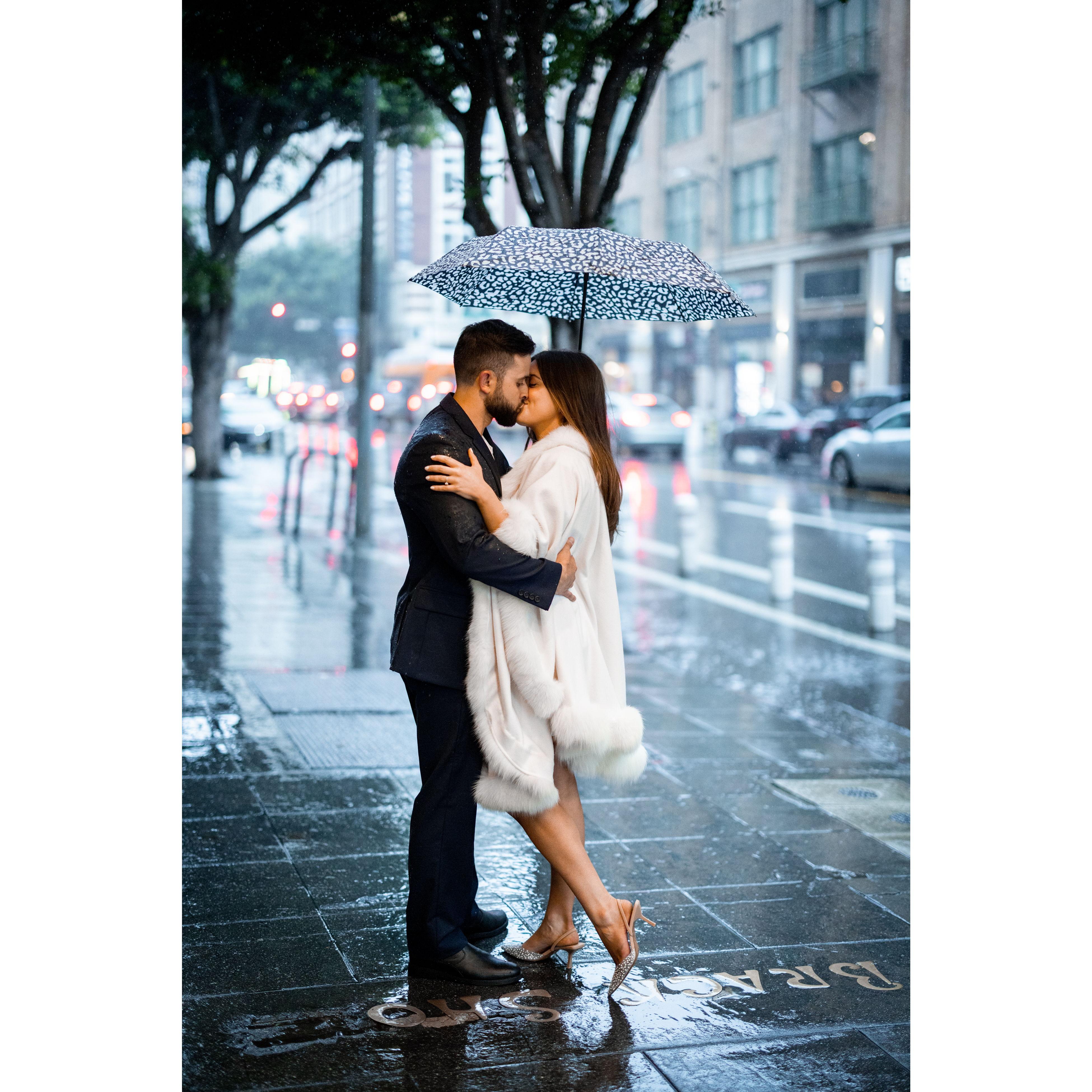 2024 - The remaining photos are from our engagement shoot in Downtown LA. The rain didn't stop us from capturing many special moments, including this one!