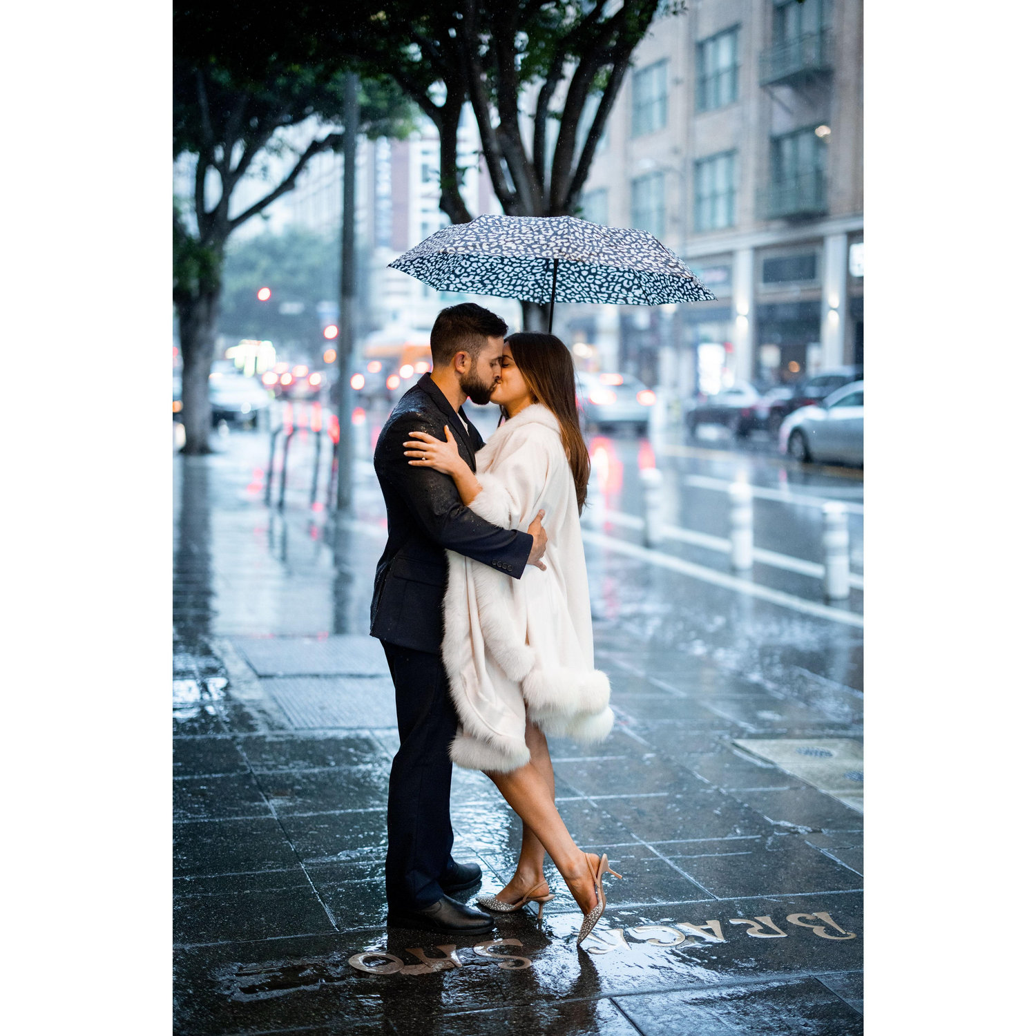 2024 - The remaining photos are from our engagement shoot in Downtown LA. The rain didn't stop us from capturing many special moments, including this one!
