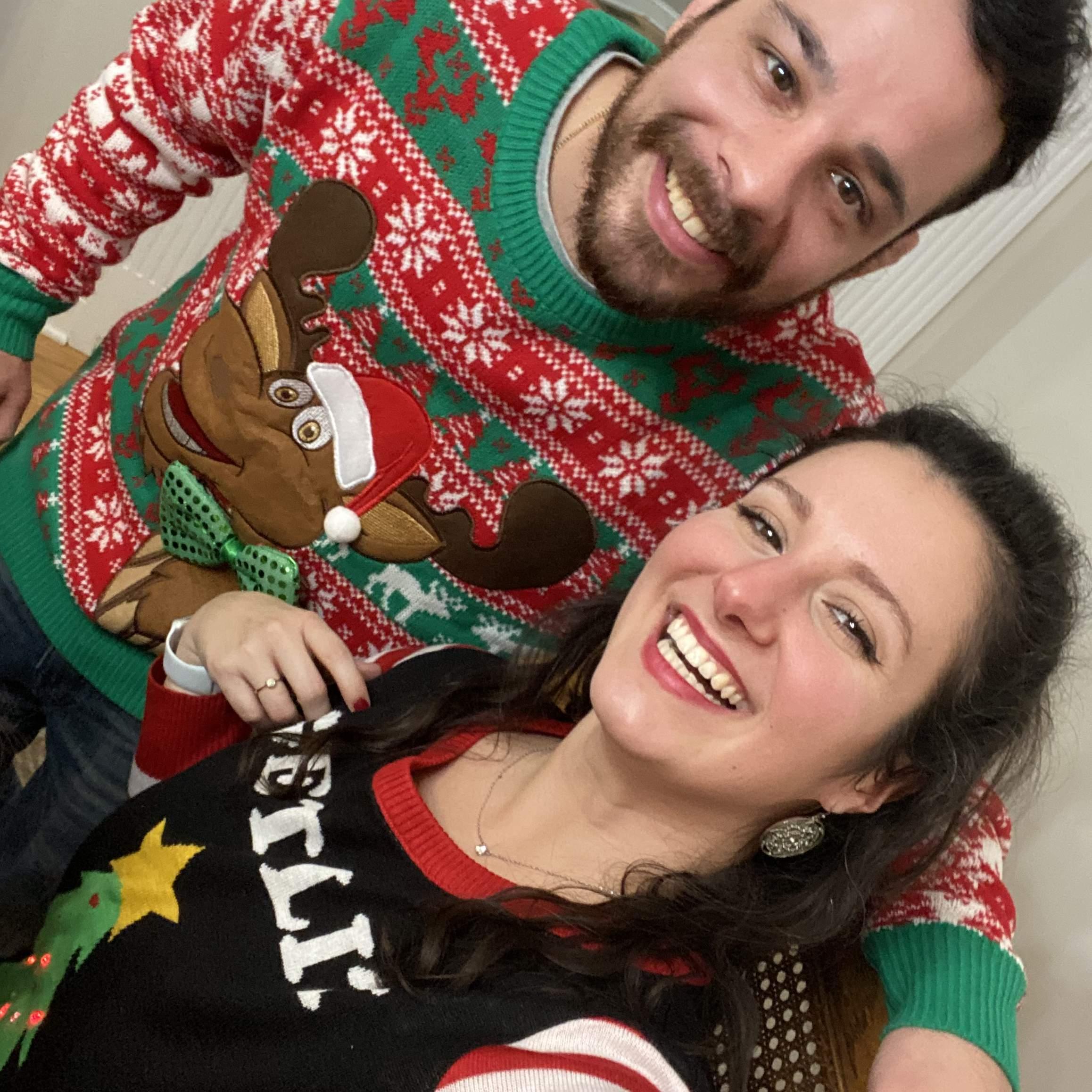Kat and Joe in their ugly Christmas sweaters gifted by best friends, Brittany and Jake for quarantine Christmas!