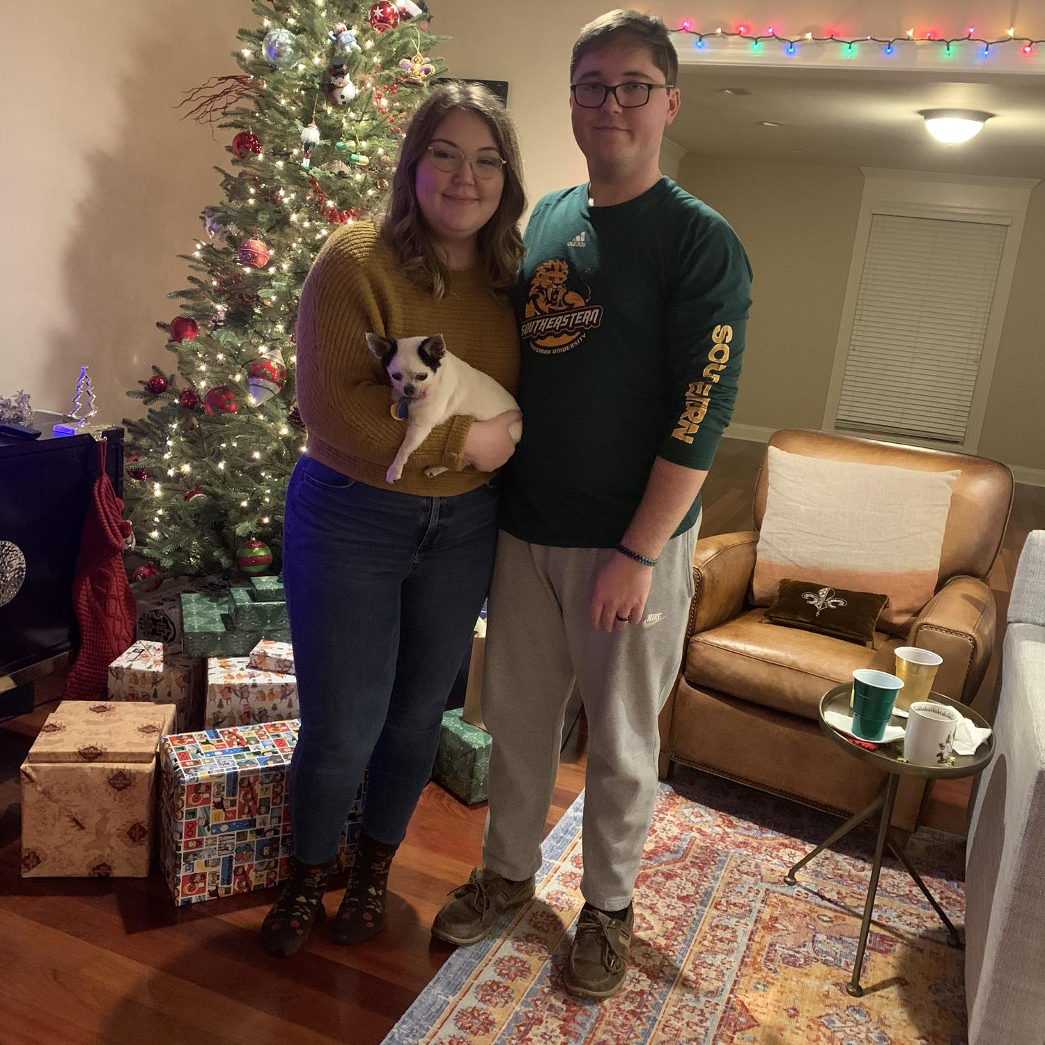 Christmas festivities at Uncle Tim & Dustin's House! Ari is holding beloved Tiki, who is now an angel puppy! New Orleans, LA. 12.23.21.