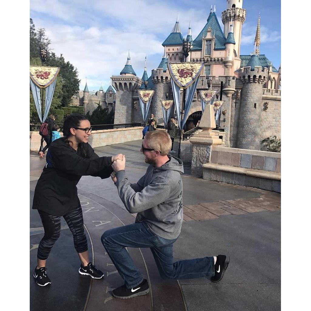 This was at Disneyland (obviously) Paige's cheerleaders kept asking when the wedding was, so we faked a proposal and posted it on Instagram to prank the cheerleaders.