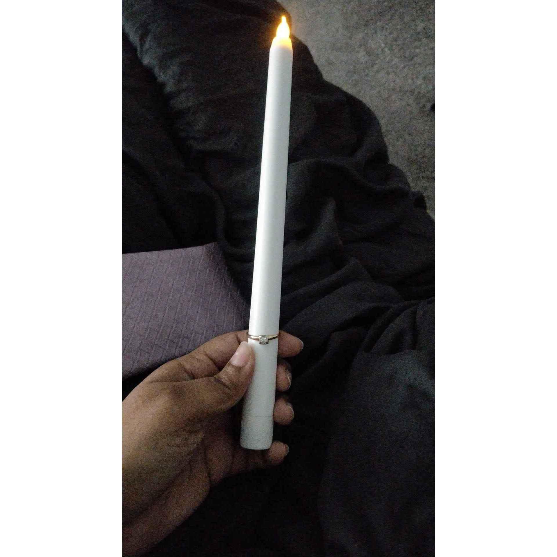 The candle he proposed with, and in the background, you can see the glasses pouch that was carrying the message