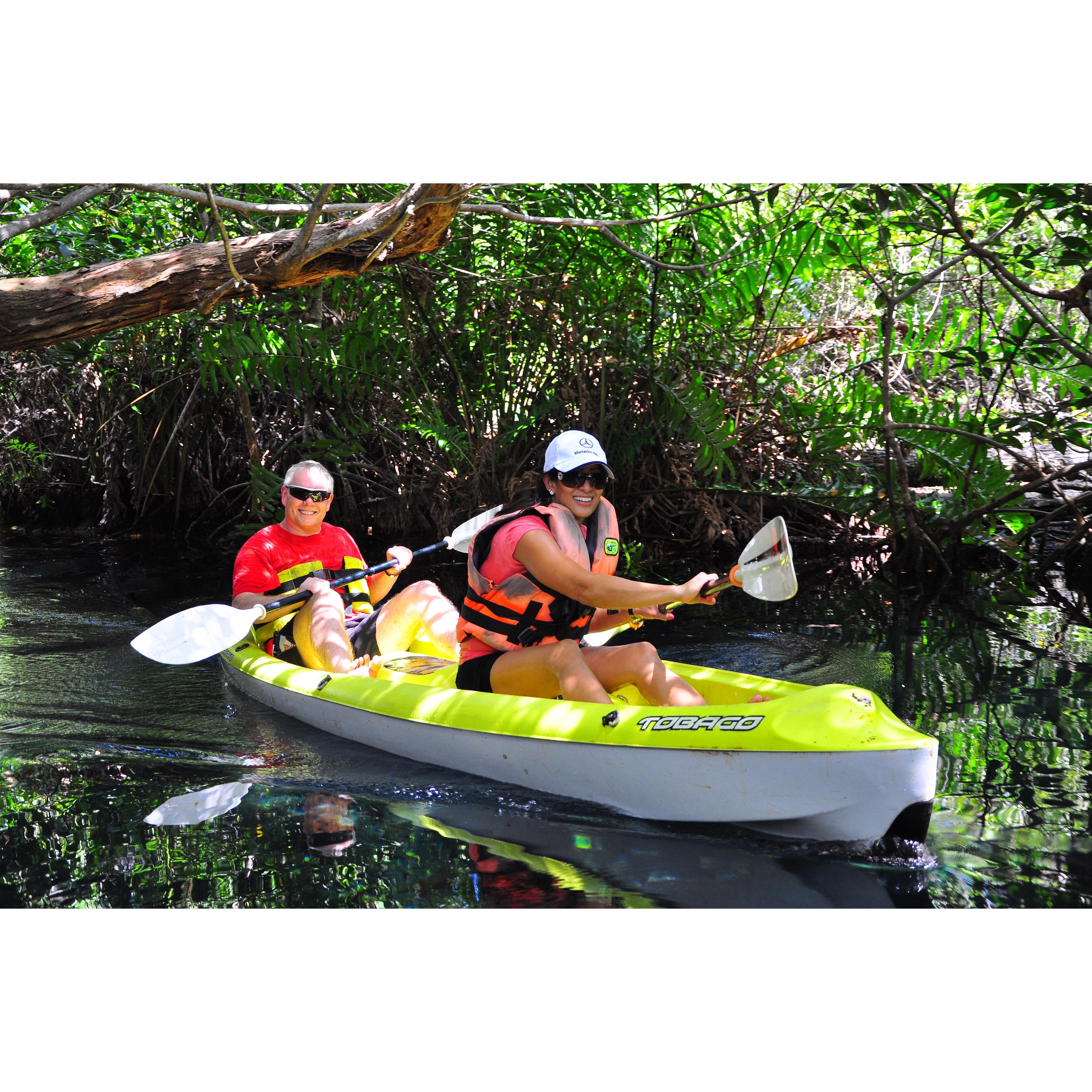 Kayaking on fresh cenote river water heading towards the ocean in Tres Rios, Mexico