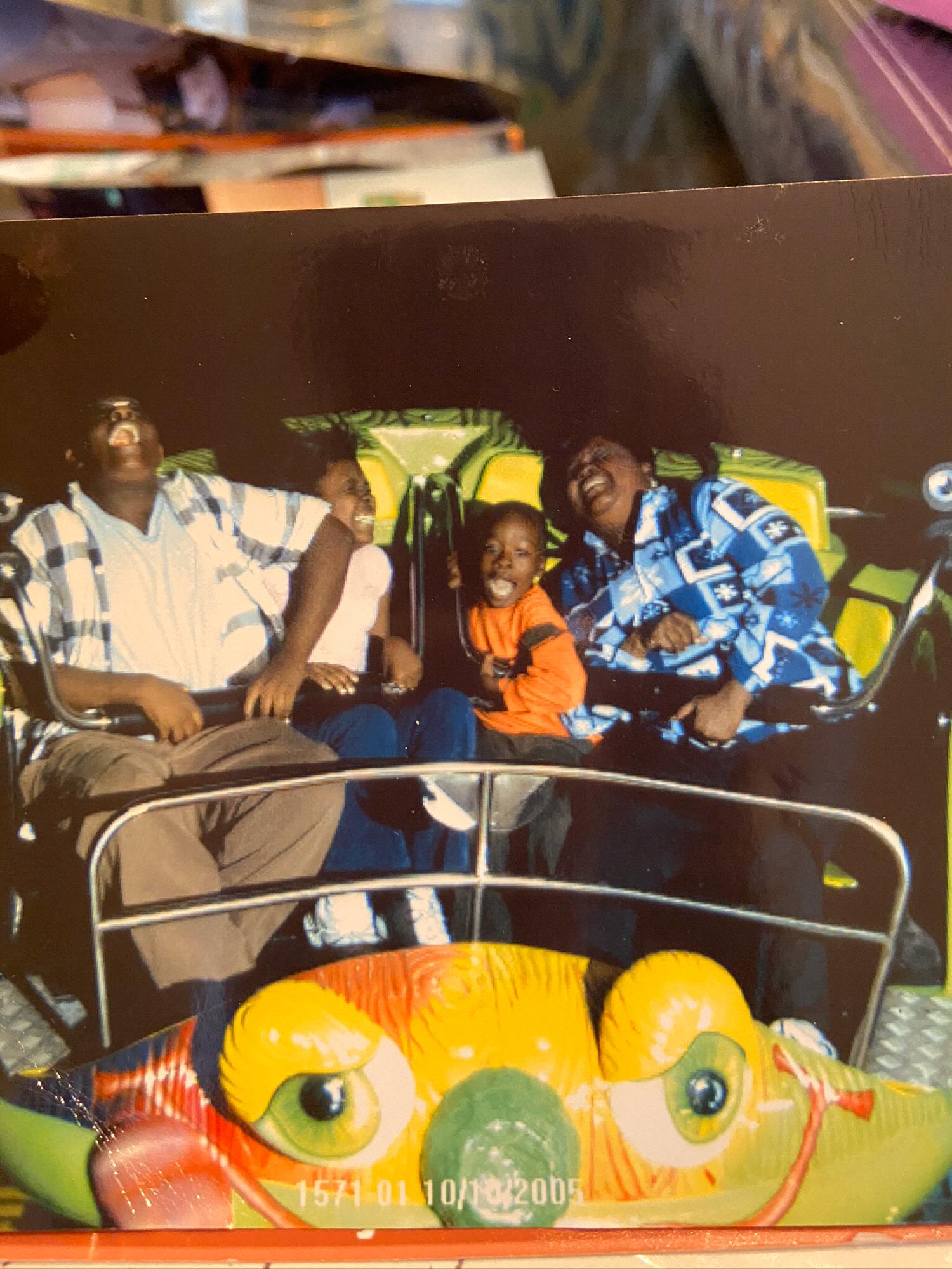 Julian, Jade, Jordan and mother having the time of their lives on a ride