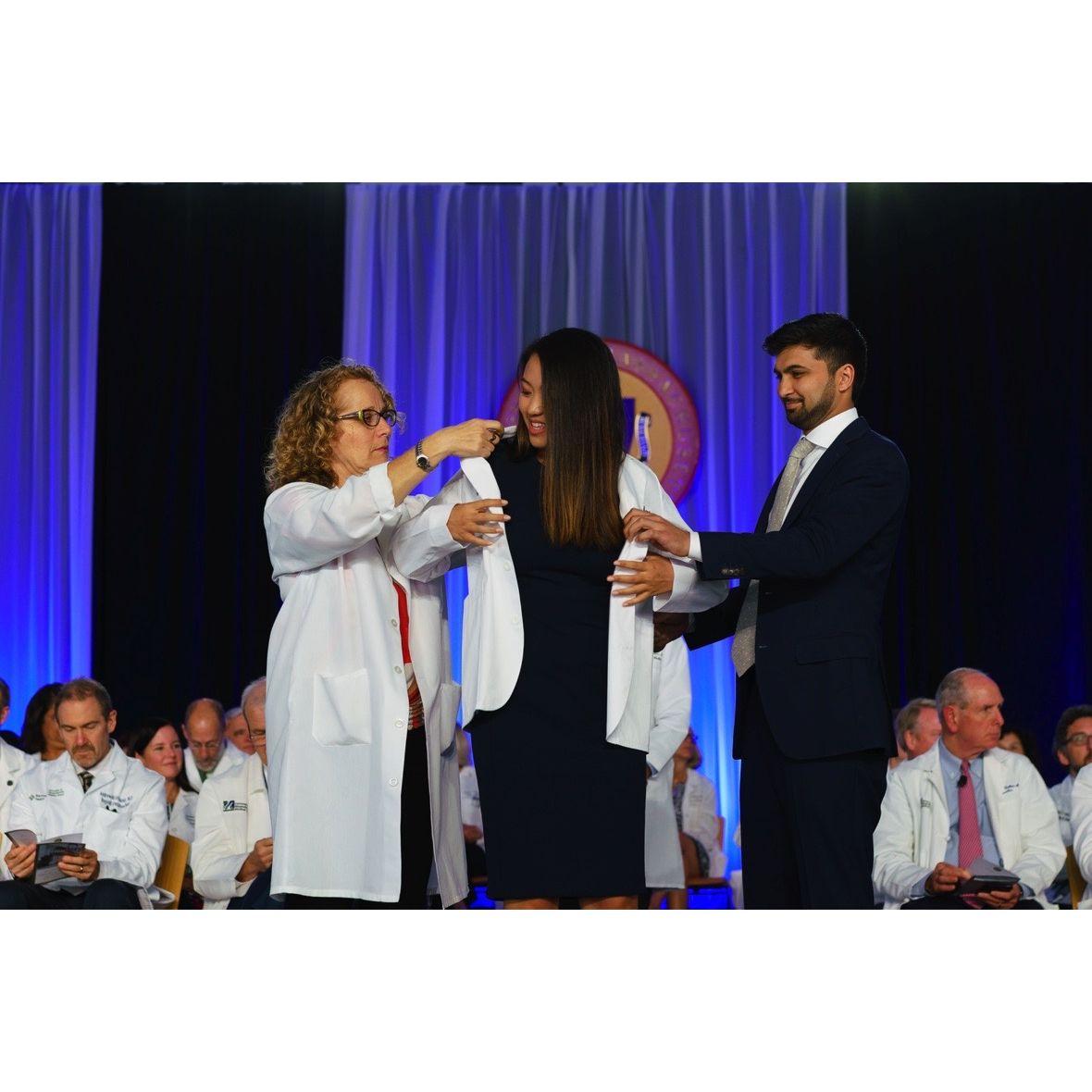 Rohan doing the honors at Grace's white coat ceremony! (2019)