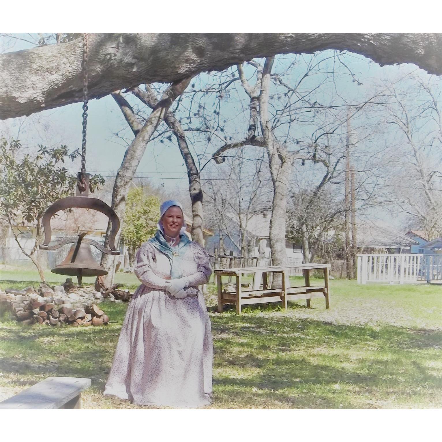 Vanessa ringing the bell after the reading of each name of the Alamo Defenders at the Reembrace Ceremony 2021, Museum of Texas Handmade Furniture