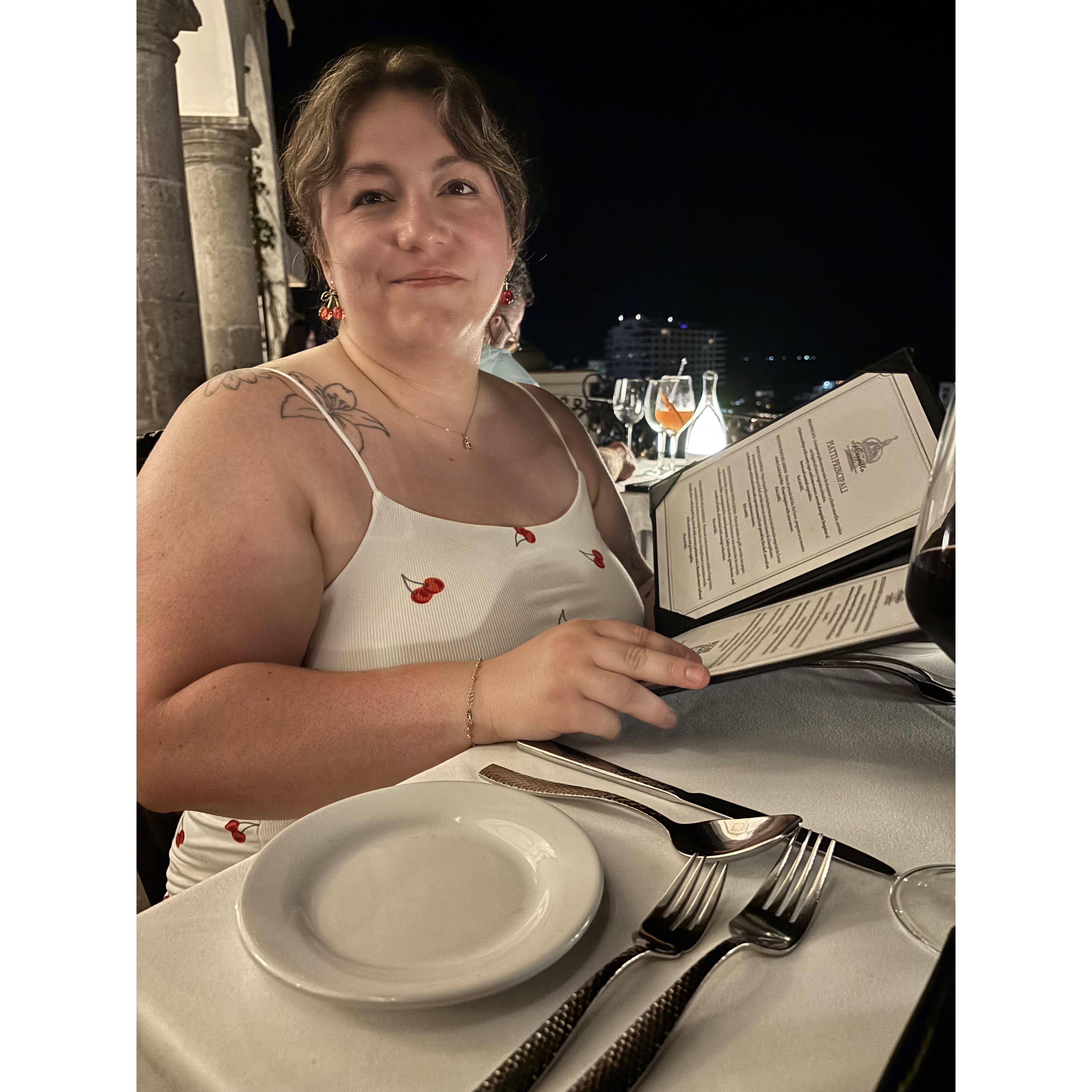 My stunning wife looking over the menu of my favorite restaurant we went to during our Mexico trip. -Kelly