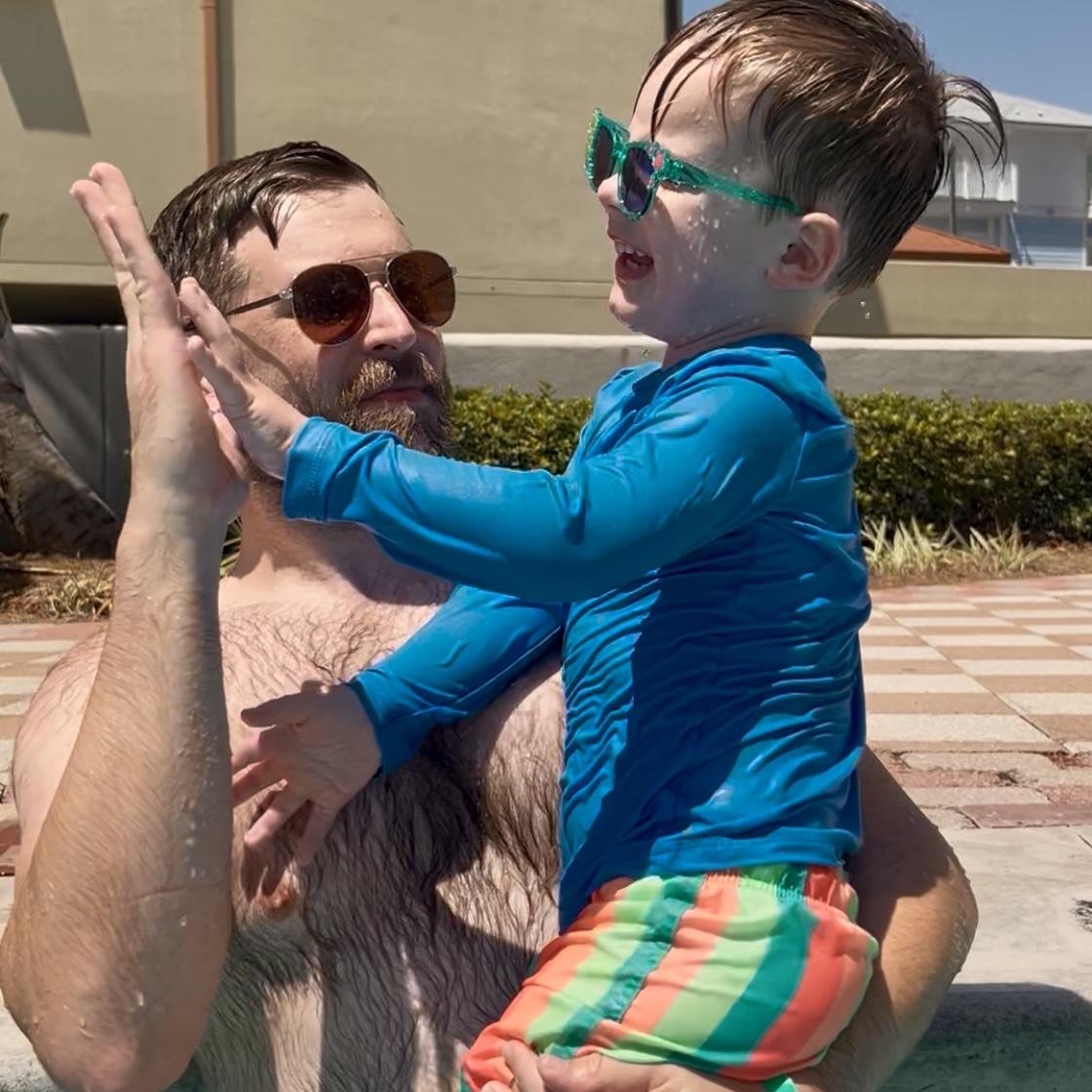 Celebrating after William successfully did the kids water slide by himself!
