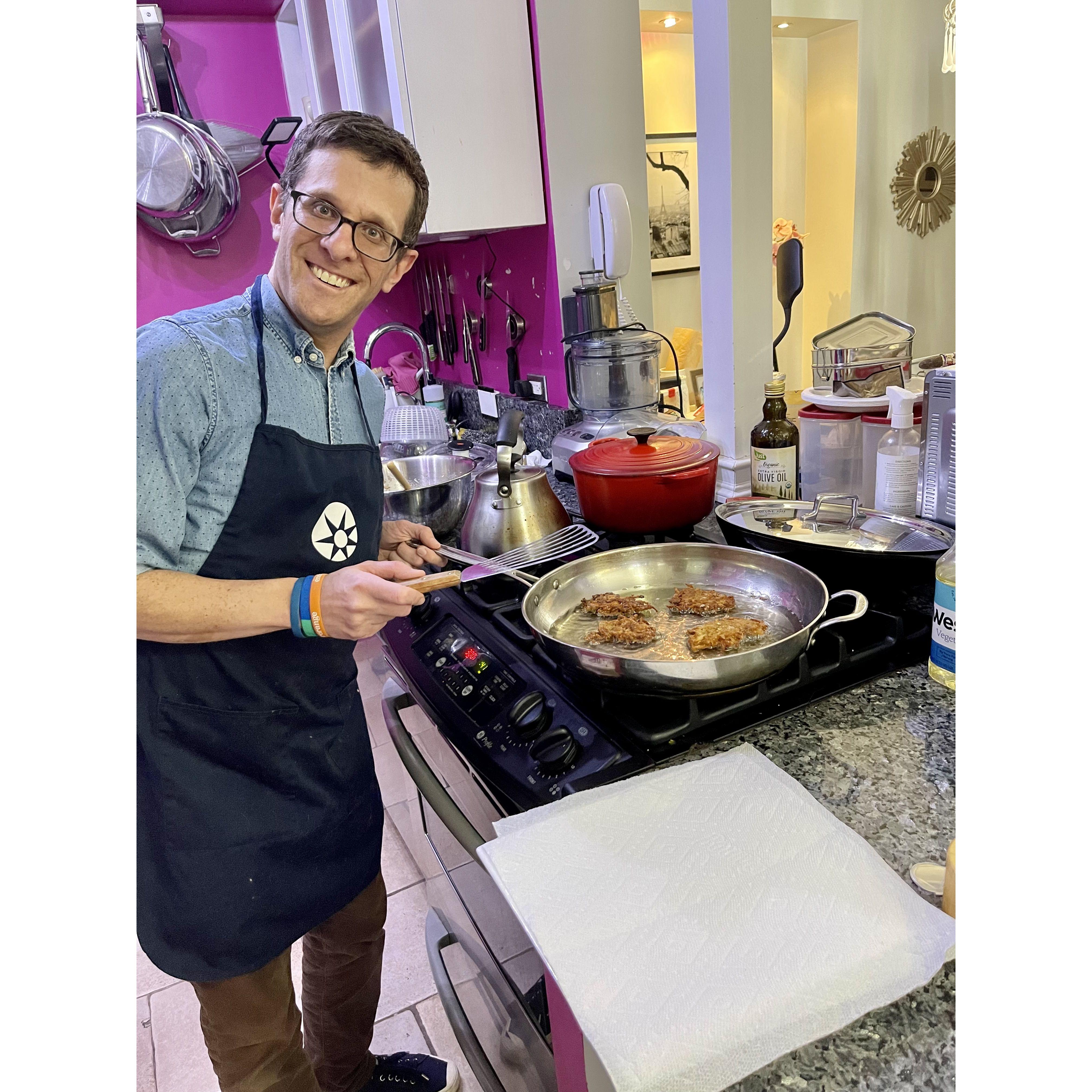 Andrew making latkes on Chanukah