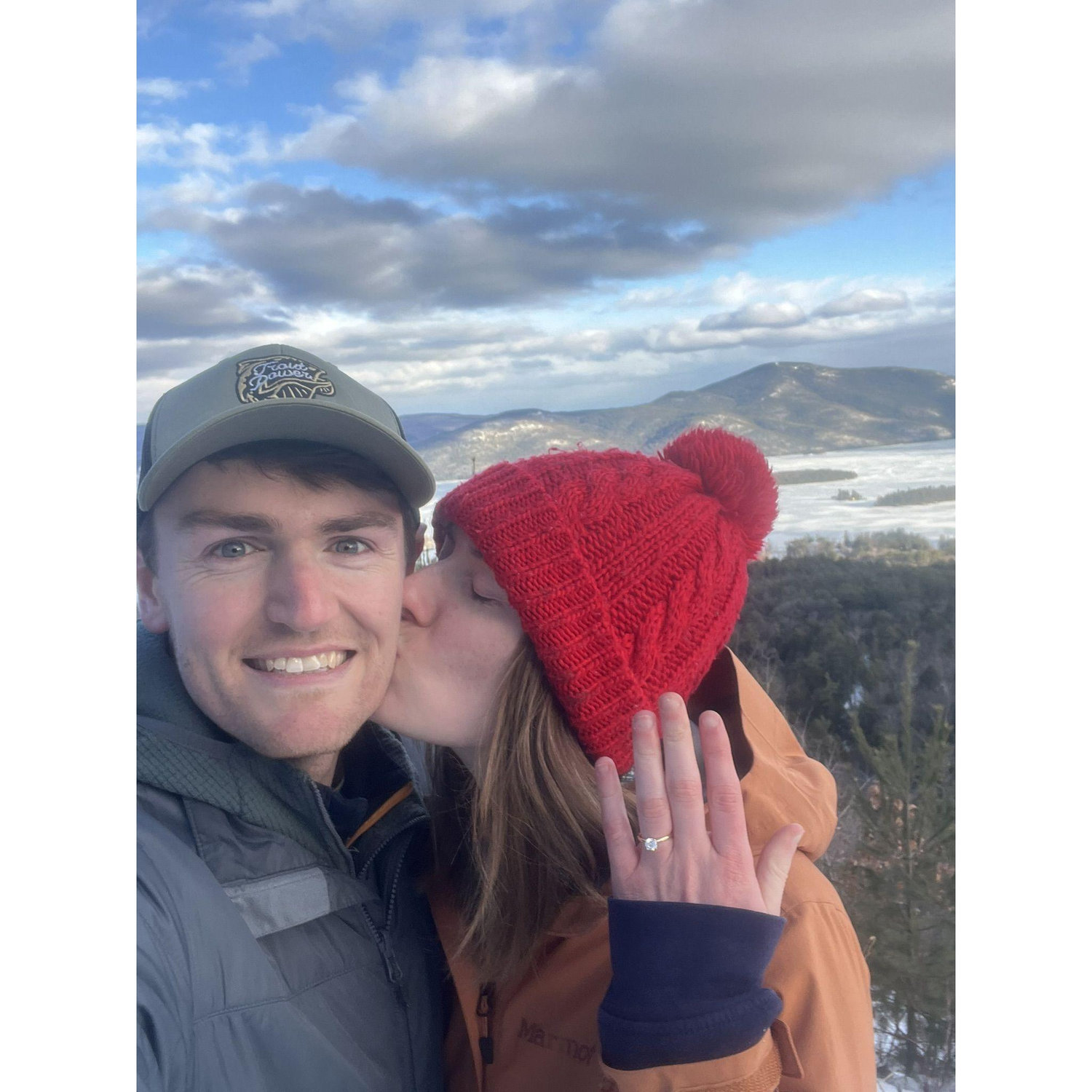 On top of The Pinnacle overlooking a snowy Lake George is where Bridget said yes!