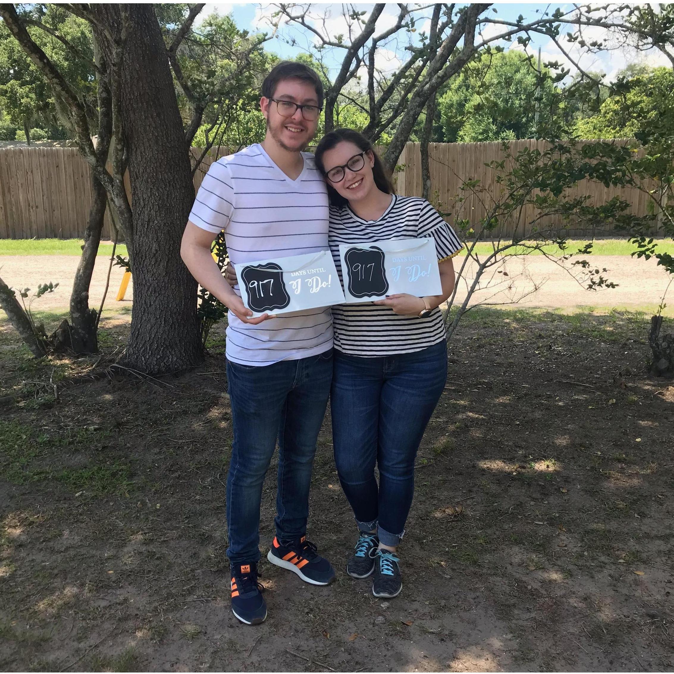 Our engagement has been long compared to most, but we've been planning the entire time! This was taken the day we signed for our venue, 917 days away from the wedding day!