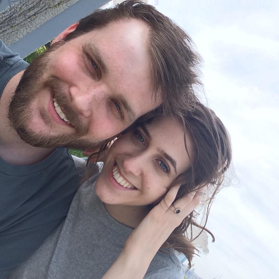Seconds after our engagement, we decided to take a photo in the heavy wind.