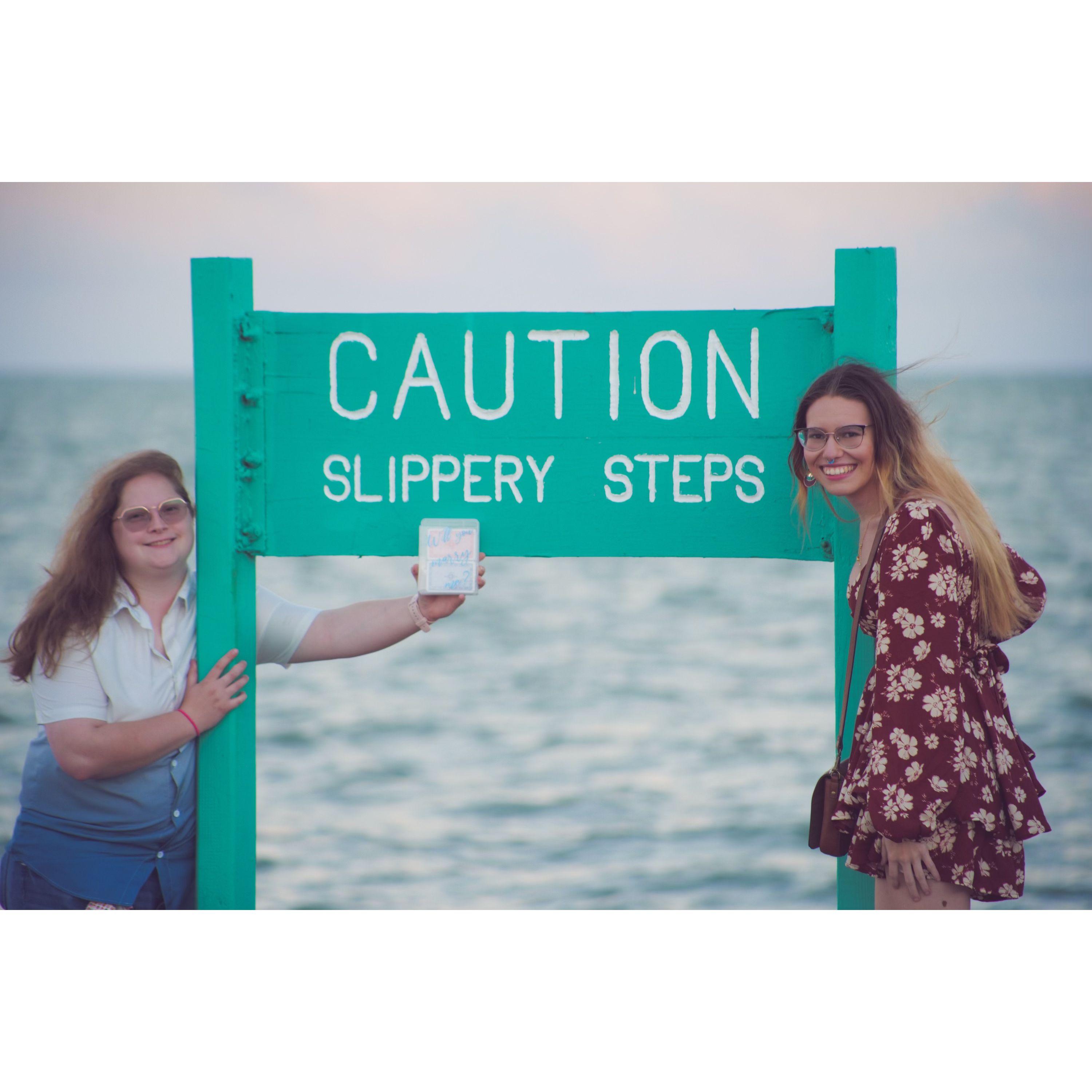 Makenzi proposed on some steps by the bay and Mandi thought this sign was hilarious, so we had to take a picture.