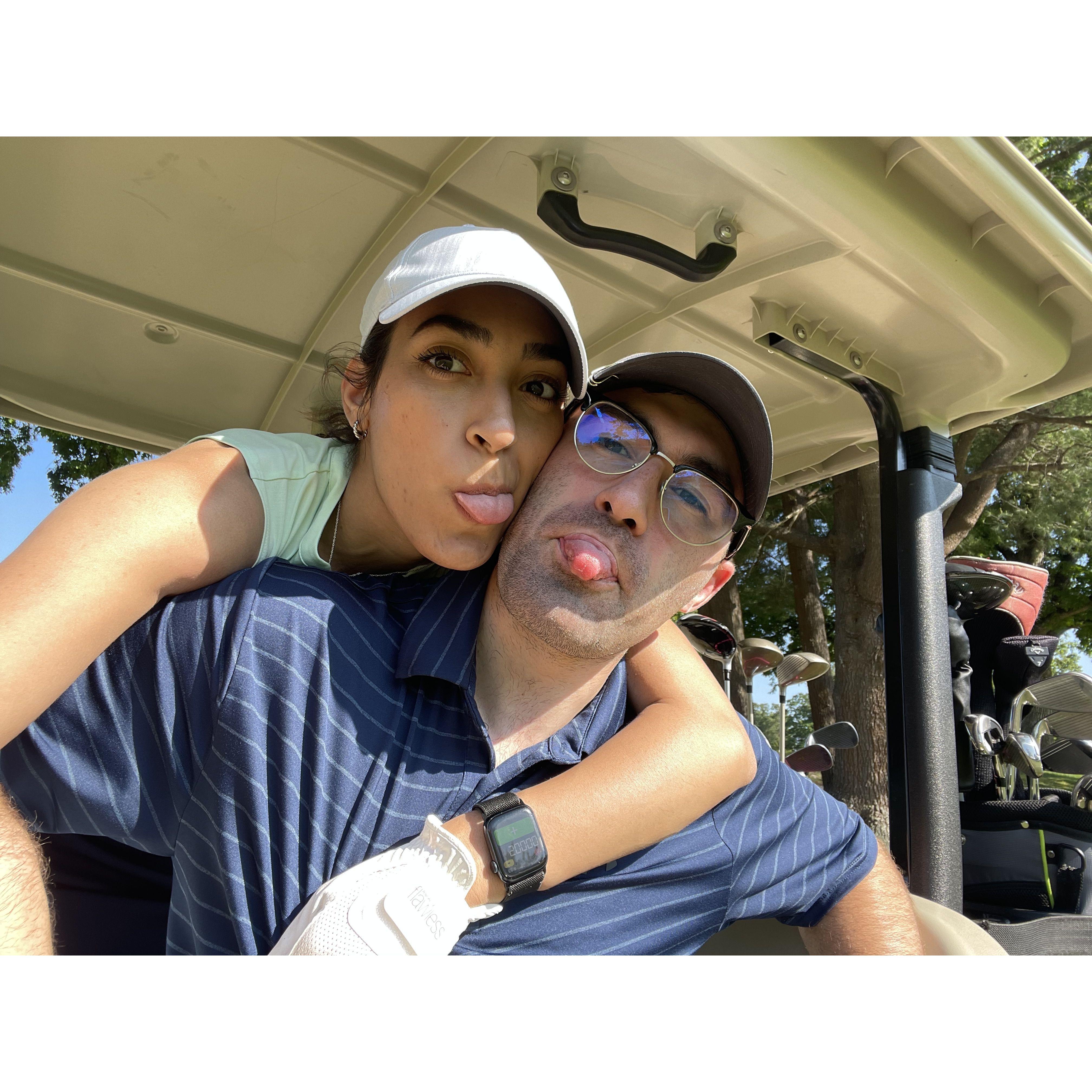 Chris teaching Maggie how to golf